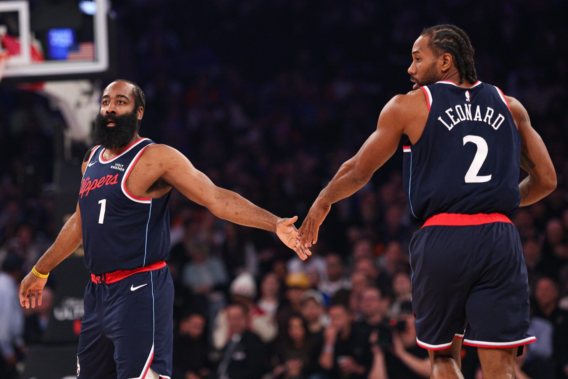 LA Clippers guard James Harden (1) slaps hands with forward Kawhi Leonard (2) during the first quarter against the New York Knicks at Madison Square Garden.
