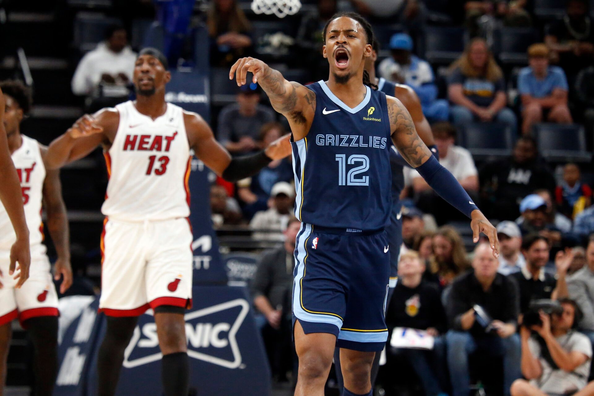Memphis Grizzlies guard Ja Morant (12) reacts during the first quarter against the Miami Heat at FedExForum.