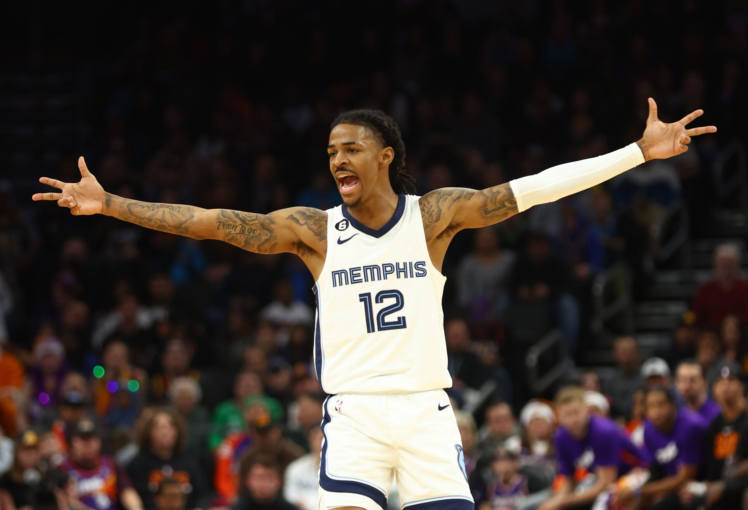 Memphis Grizzlies guard Ja Morant (12) celebrates a shot against the Phoenix Suns in the second half at Footprint Center.