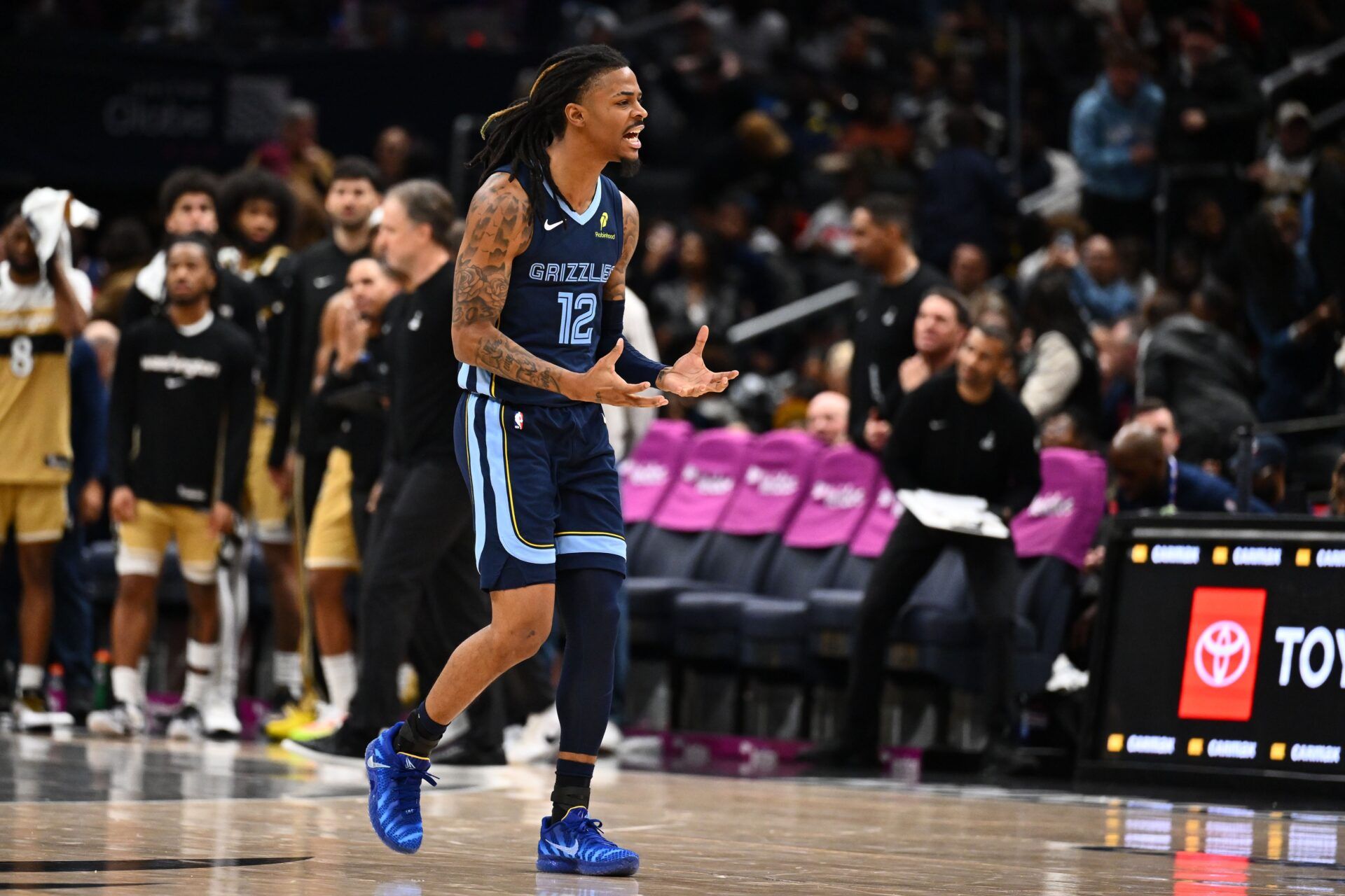 Memphis Grizzlies guard Ja Morant (12) reacts after a three point shot against the Washington Wizards during the second half at Capital One Arena.