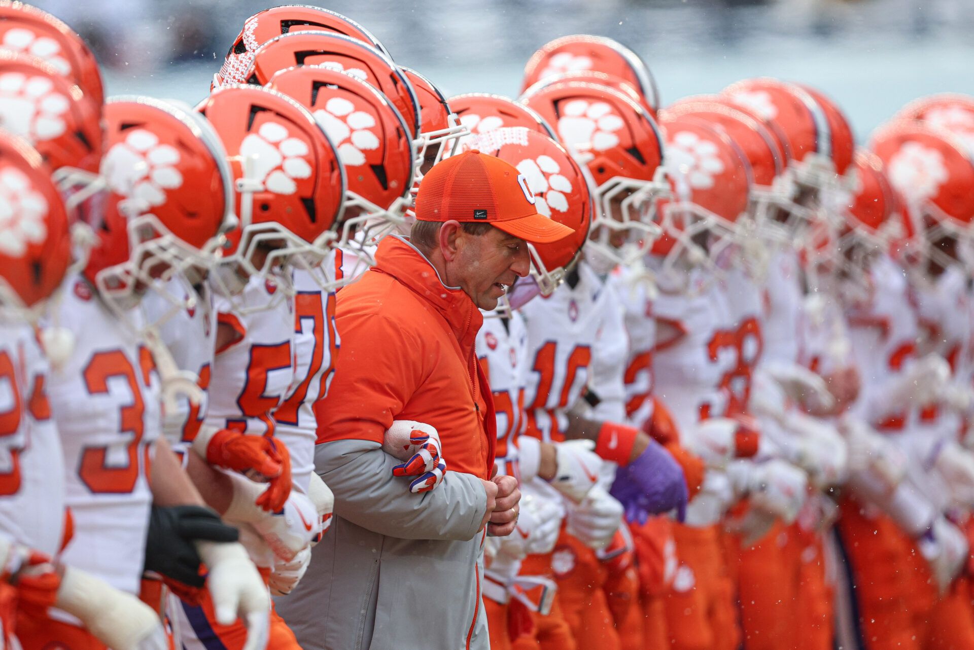 Clemson Tigers head coach Dabo Swinney walks with players before the 2025 Pinstripe Bowl against the Penn State Nittany Lions at Yankee Stadium.