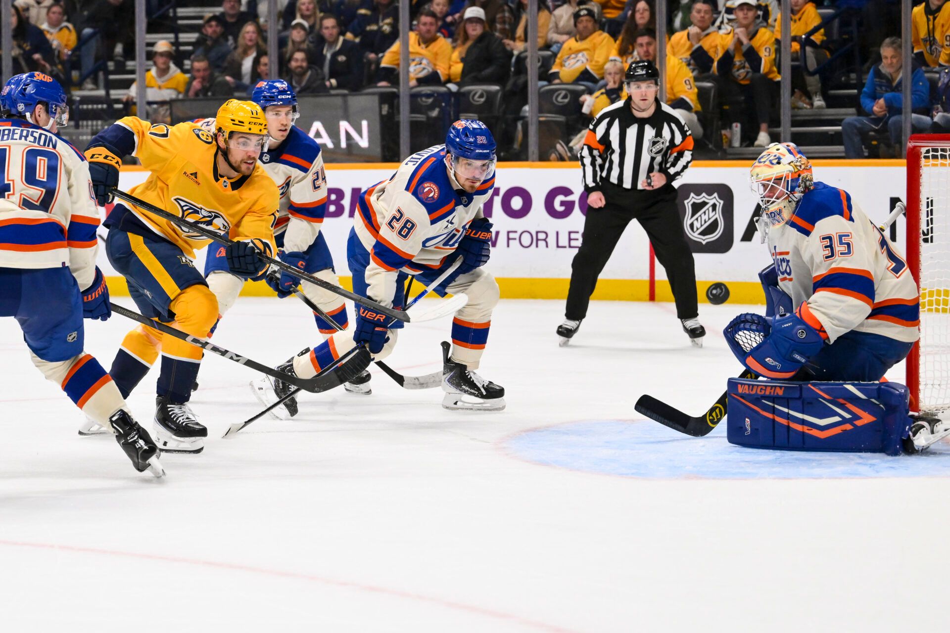 Edmonton Oilers goaltender Tristan Jarry (35) blocks the shot of Nashville Predators center Tyson Jost (17) during the third period at Bridgestone Arena.