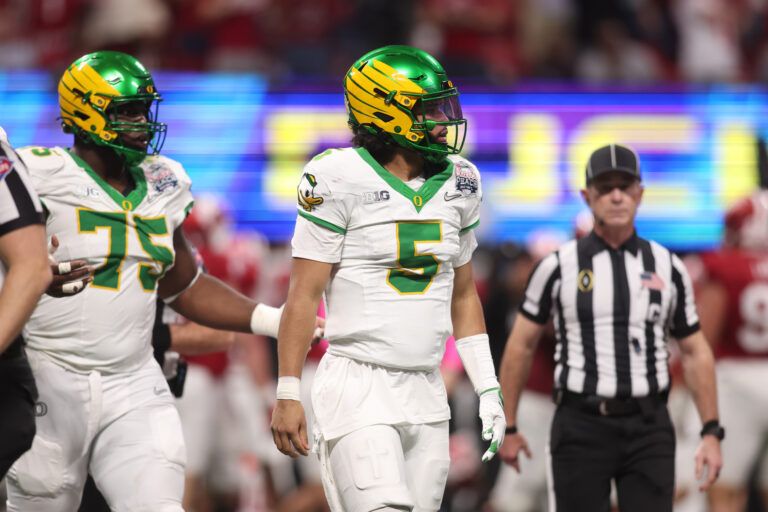 Oregon Ducks quarterback Dante Moore (5) reacts after a fumble against the Indiana Hoosiers during the first half of the 2025 Peach Bowl and semifinal game of the College Football Playoff at Mercedes-Benz Stadium.