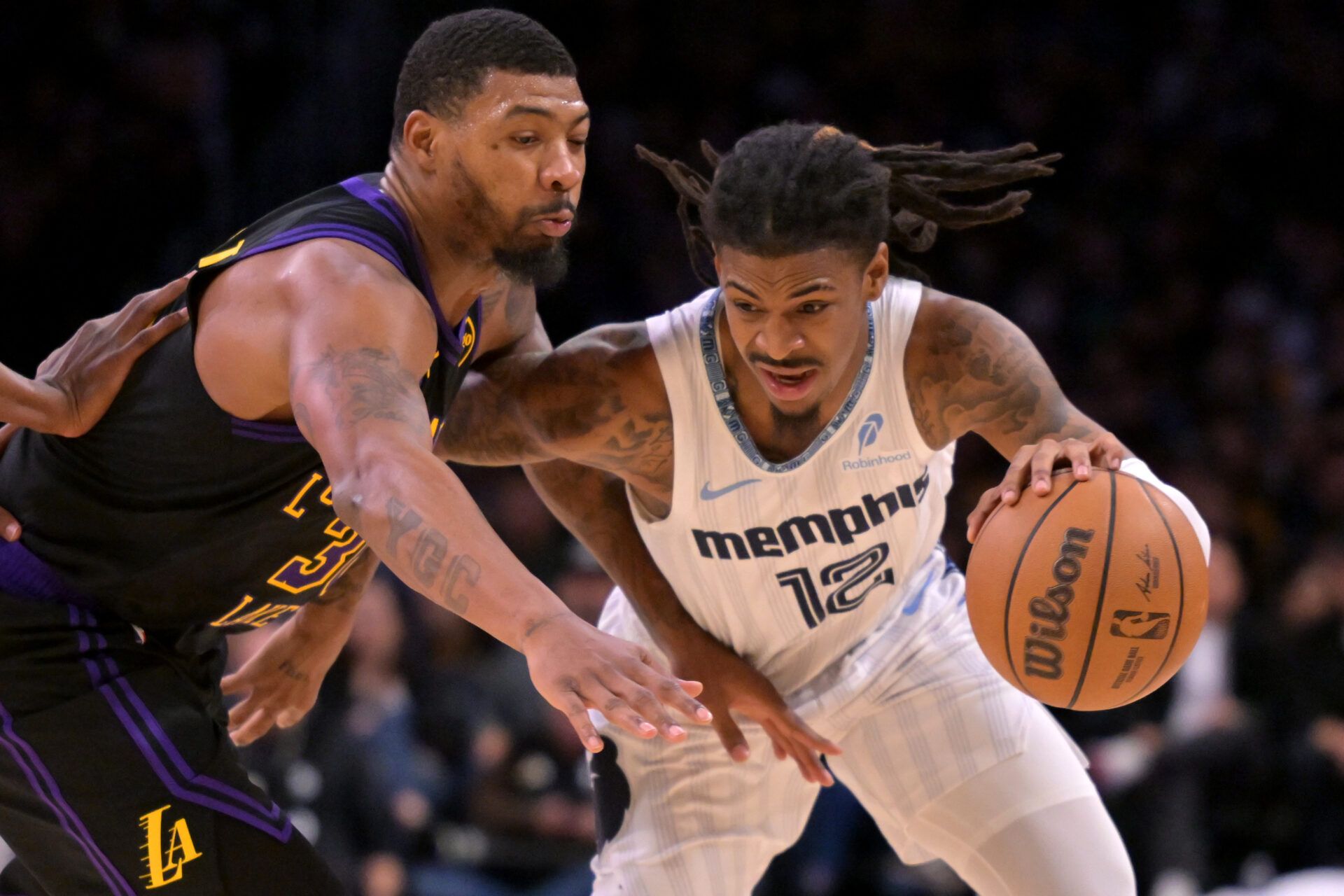 Los Angeles Lakers guard Marcus Smart (36) defends Memphis Grizzlies guard Ja Morant (12) as he drives to the basket in the second half at Crypto.com Arena.