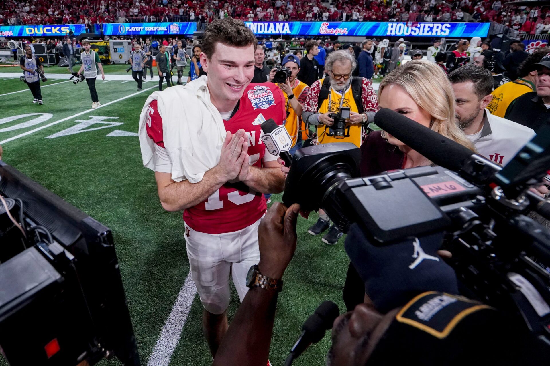 Indiana Hoosiers quarterback Fernando Mendoza (15) is interviewed on the field Friday, Jan. 9, 2026, after defeating the Oregon Ducks in the Peach Bowl and semifinal game of the College Football Playoff at Mercedes-Benz Stadium in Atlanta.