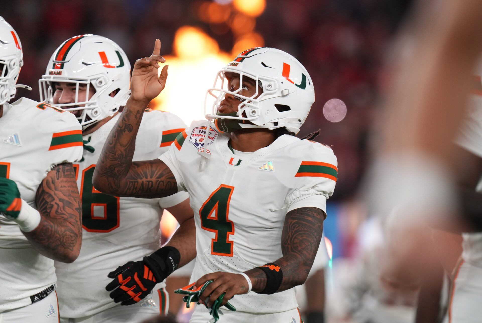 Miami Hurricanes running back Mark Fletcher Jr. (4) takes the field before they play the Ole Miss Rebels during their Vrbo Fiesta Bowl matchup at State Farm Stadium in Glendale, on Jan. 8, 2026.
