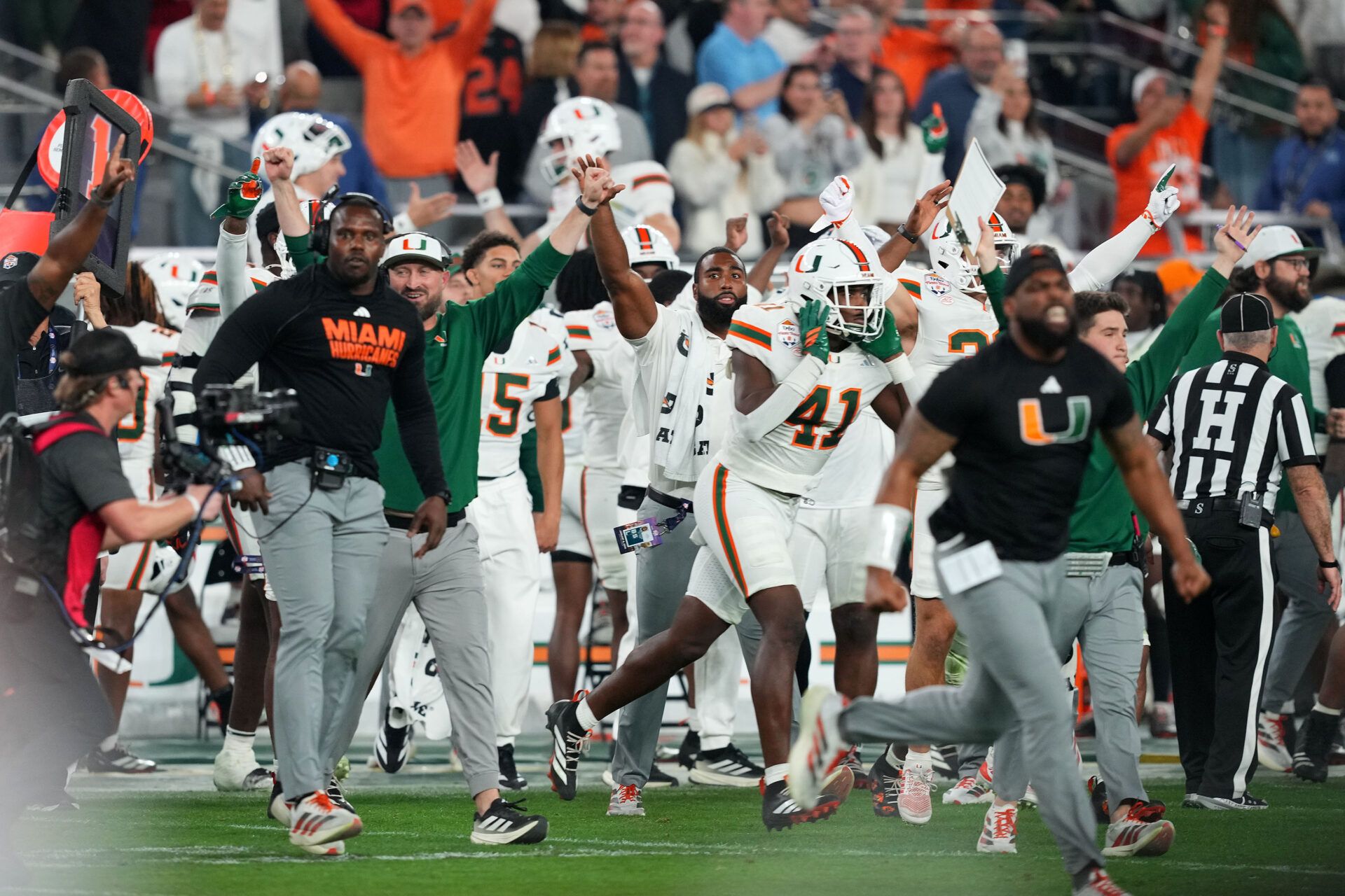 The Miami Hurricanes react after the second half during the 2026 Fiesta Bowl and semifinal game of the College Football Playoff at State Farm Stadium.