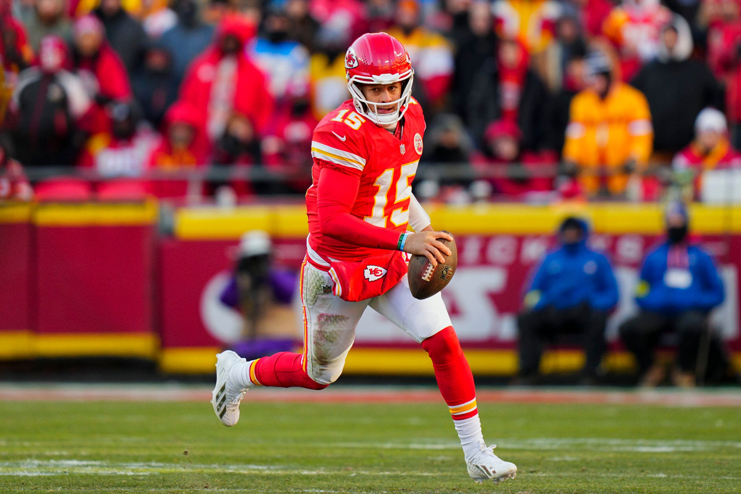Kansas City Chiefs quarterback Patrick Mahomes (15) runs the ball during the second half against the Los Angeles Chargers at GEHA Field at Arrowhead Stadium.