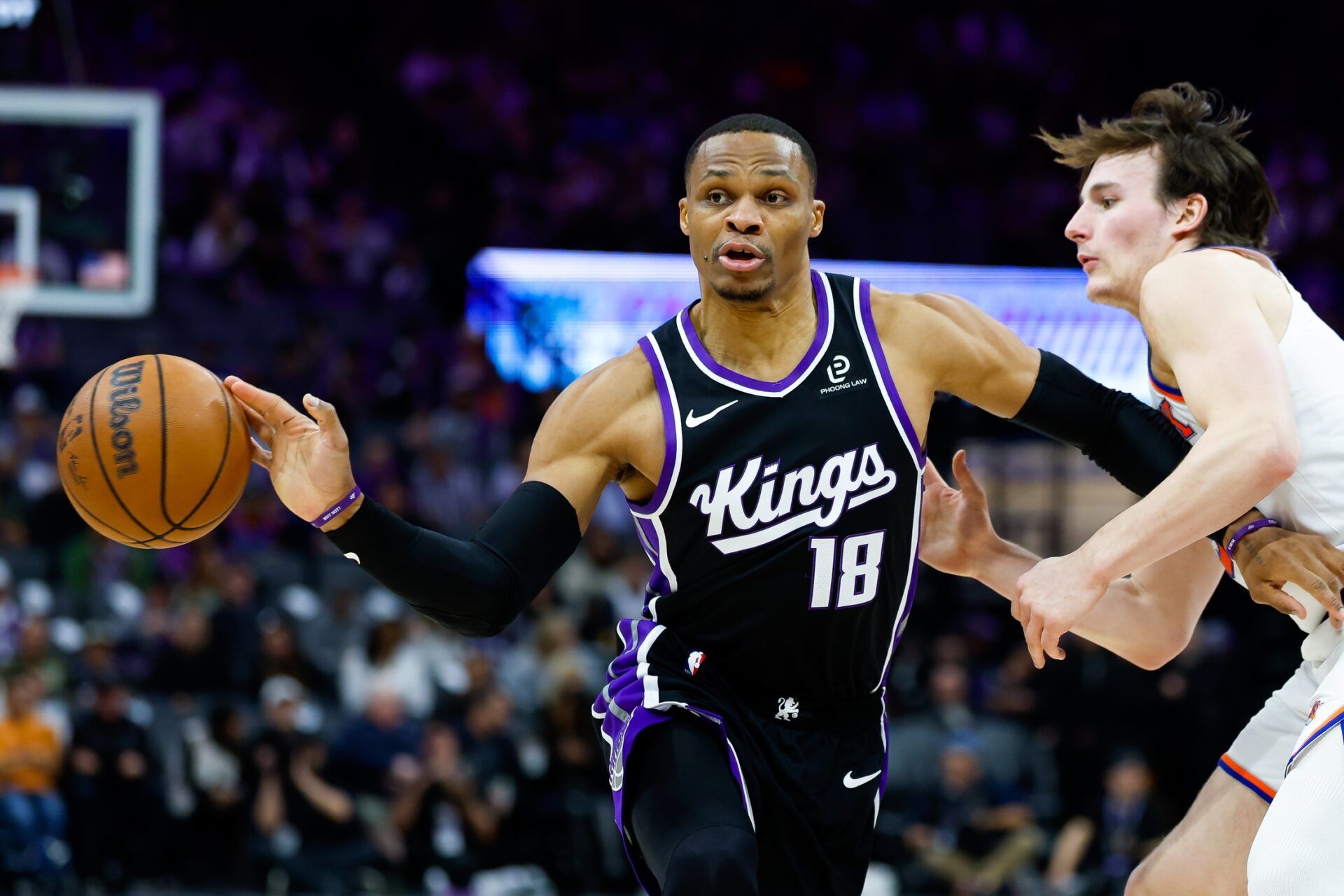 Sacramento Kings guard Russell Westbrook (18) passes the ball against New York Knicks guard Tyler Kolek (13) during the third quarter at Golden 1 Center.