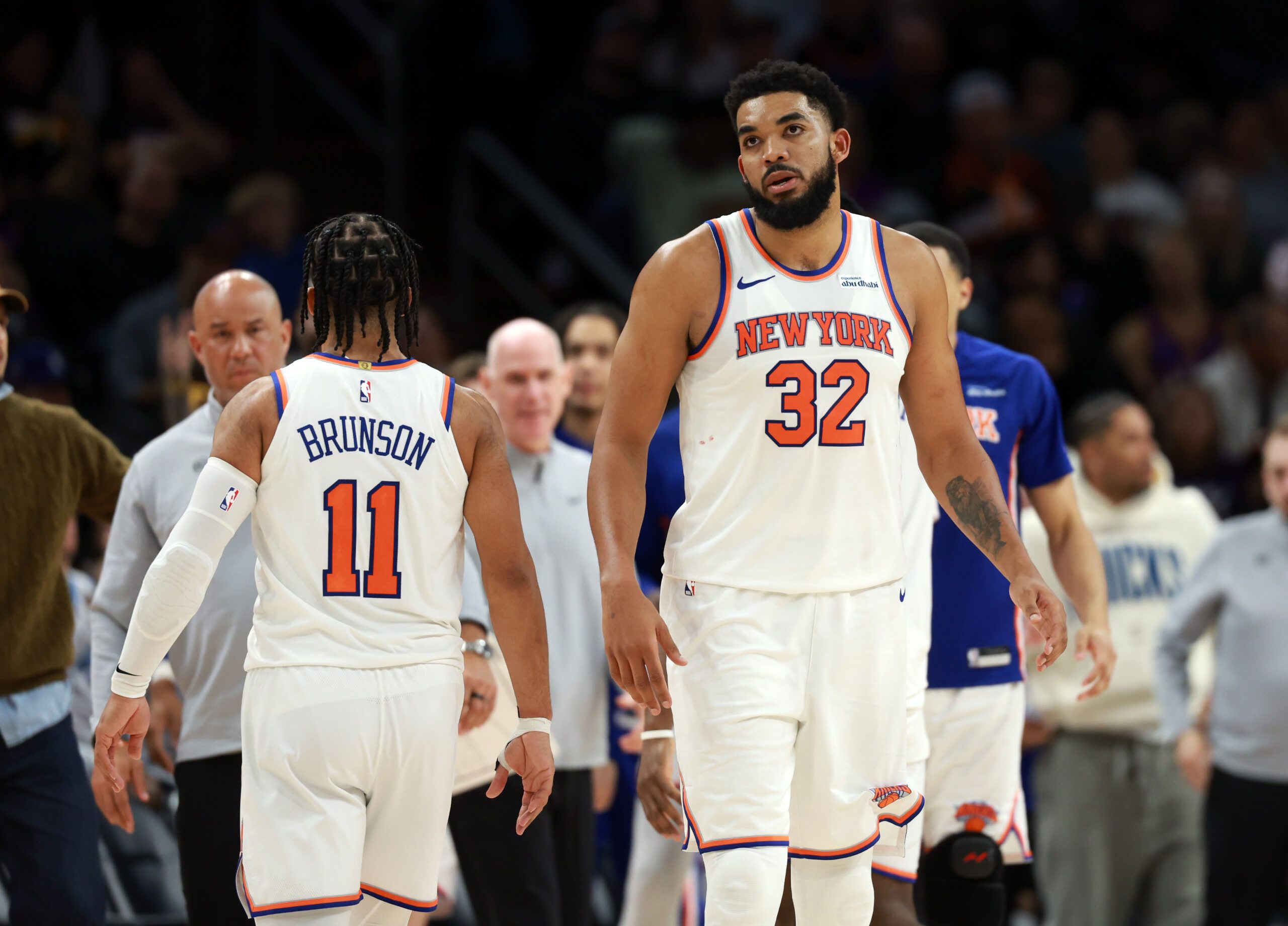 New York Knicks center Karl-Anthony Towns (32) and guard Jalen Brunson (11) against the Phoenix Suns at Mortgage Matchup Center.