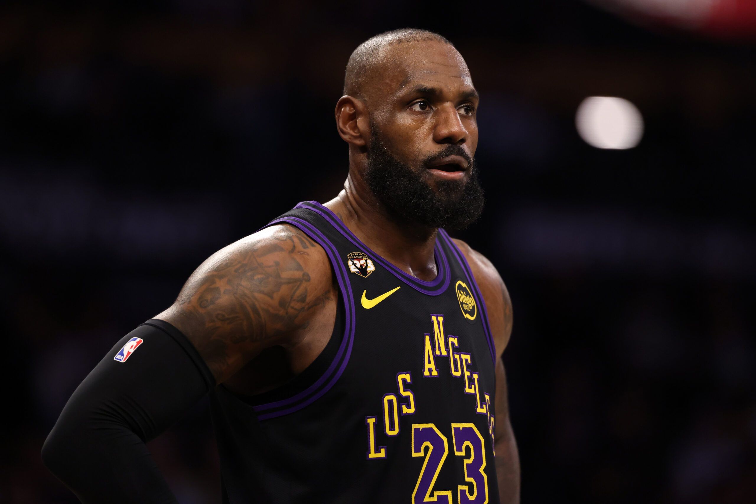 Los Angeles Lakers forward LeBron James (23) wears a patch affixed to the upper right chest to celebrate his record-setting 23rd NBA season during the first half against the Atlanta Hawks at Crypto.com Arena.