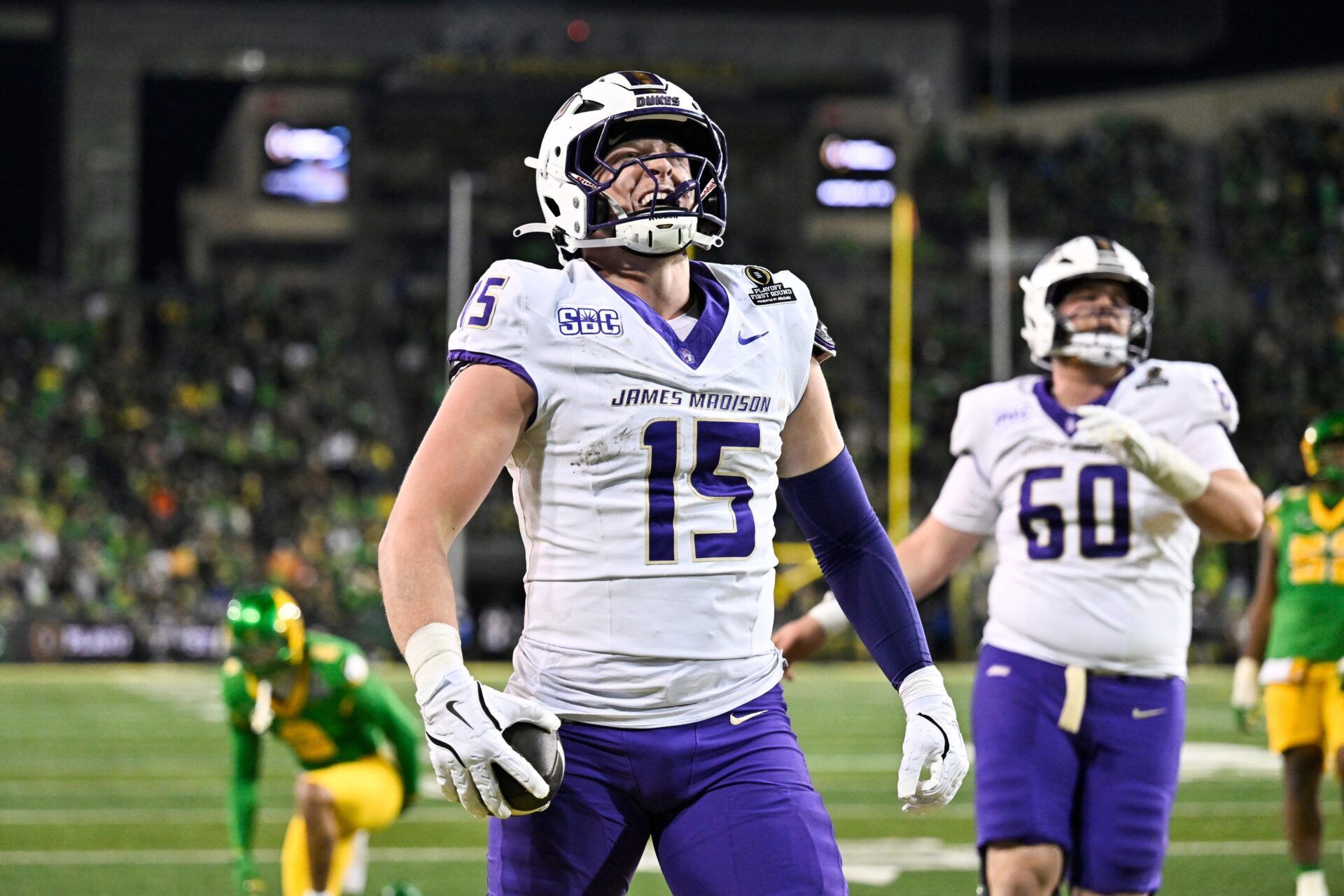 James Madison Dukes tight end Lacota Dippre (15) celebrates after scoring a touchdown during the fourth quarter against the Oregon Ducks at Autzen Stadium.
