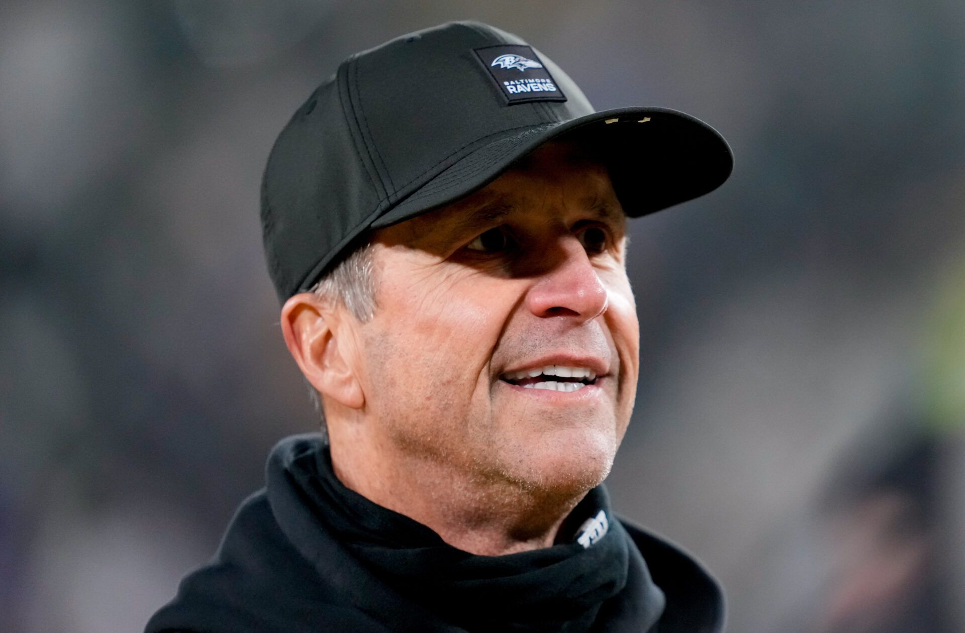 Baltimore Ravens head coach John Harbaugh walks off the field after the game against the Green Bay Packers at Lambeau Field.