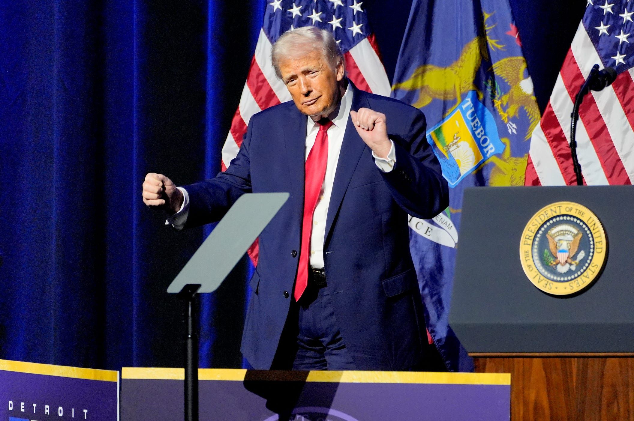 President Donald Trump dances after ending his remarks to the Detroit Economic Club at Soundboard inside the MotorCity Casino Hotel in Detroit on Tuesday, Jan. 13, 2026.