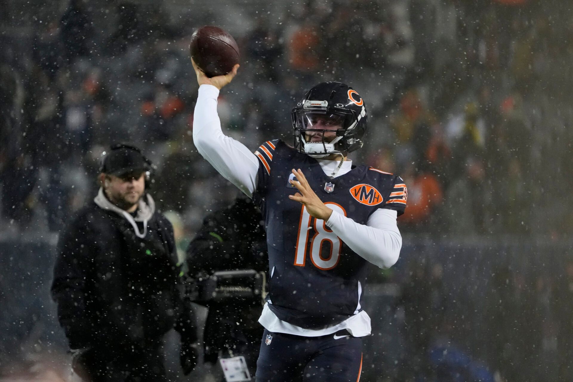 Chicago Bears quarterback Caleb Williams (18) warms up prior to an NFC Wild Card Round game against the Green Bay Packers at Soldier Field.