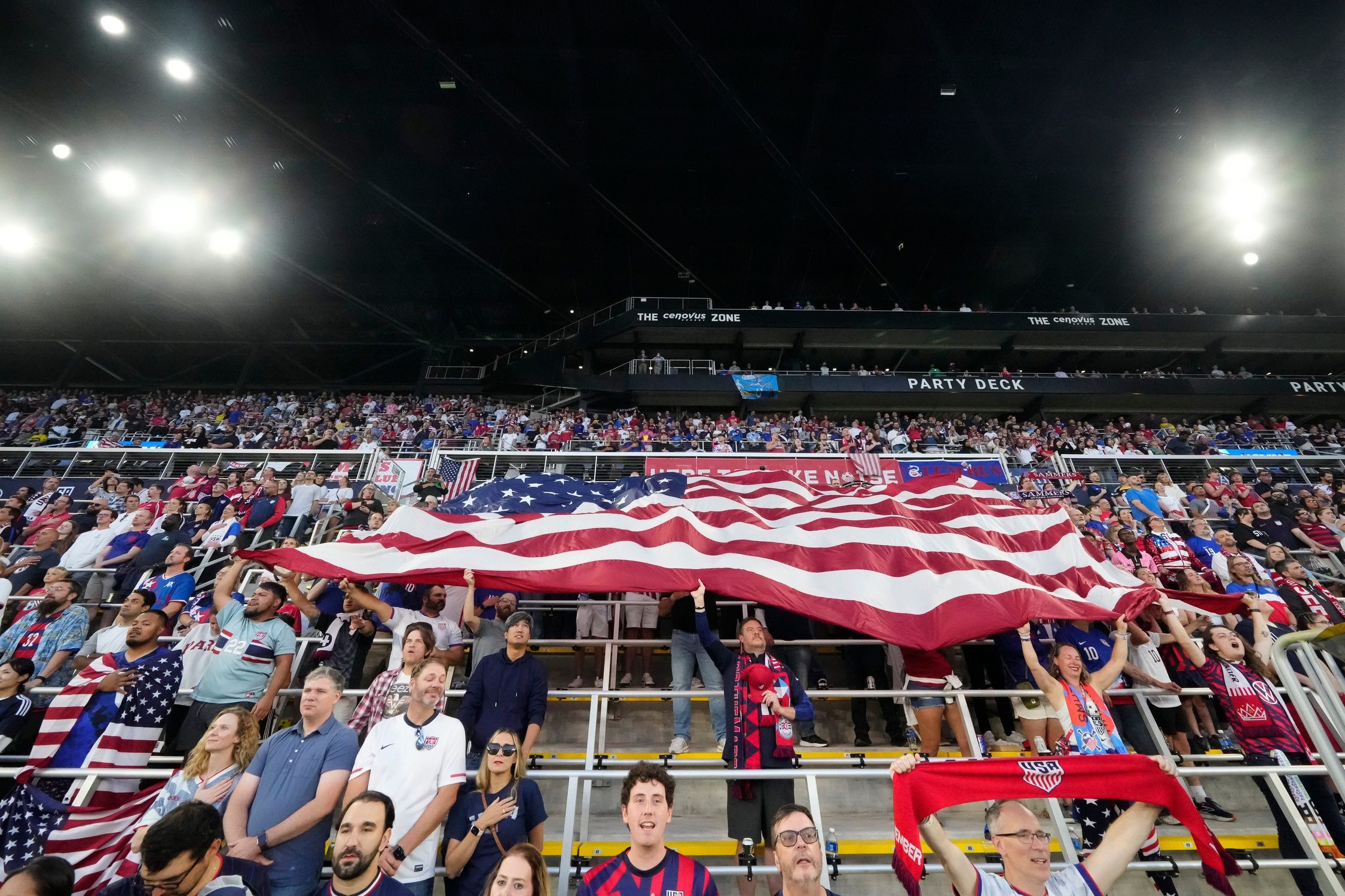 Fans hold an American flag during an international friendly soccer match between the United States Men's National Team and Japan at Lower.com Field in Columbus on Sept. 9, 2025.