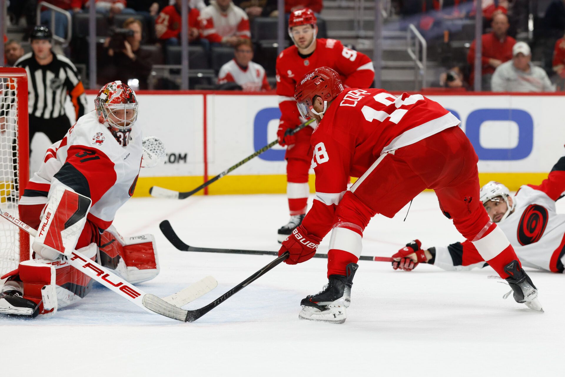 Detroit Red Wings center Andrew Copp (18) scores in overtime against the Carolina Hurricanes at Little Caesars Arena.