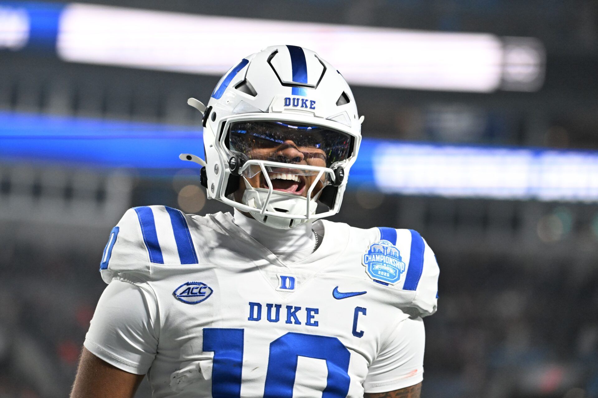 Duke Blue Devils quarterback Darian Mensah (10) celebrates after the Blue Devils score a touchdown in overtime during the  ACC Championship game at Bank of America Stadium.