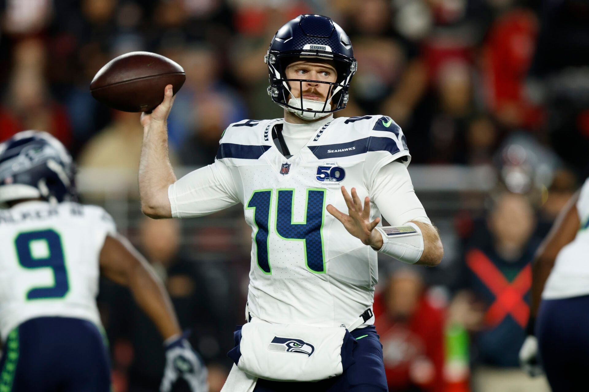 Seattle Seahawks quarterback Sam Darnold (14) drops back to pass against the San Francisco 49ers during the first half at Levi's Stadium.