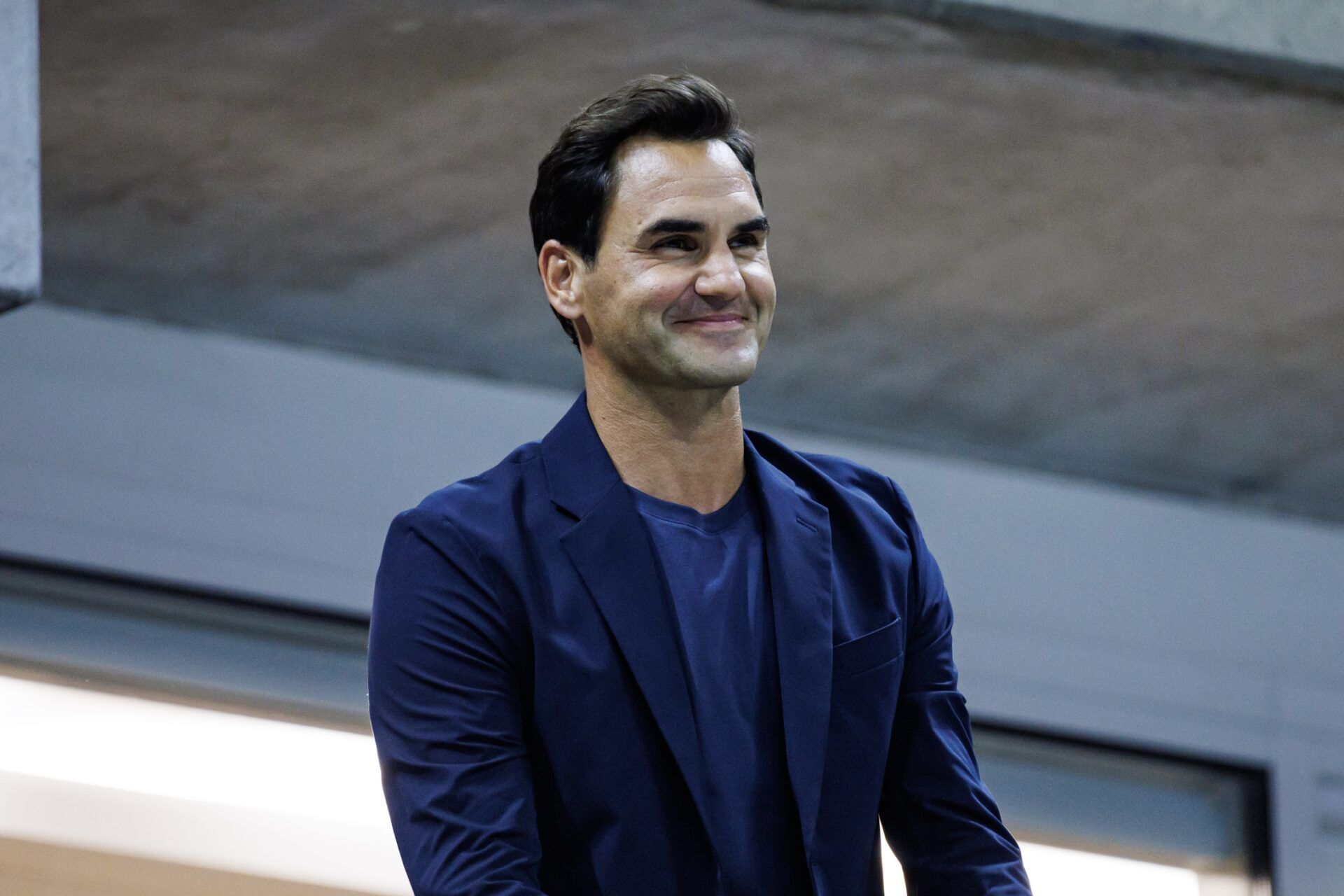 Roger Federer watches Aryna Sabalenka of Russia playing Qinwen Zheng of China on day nine of the U.S. Open tennis tournament at the USTA Billie Jean King National Tennis Center.
