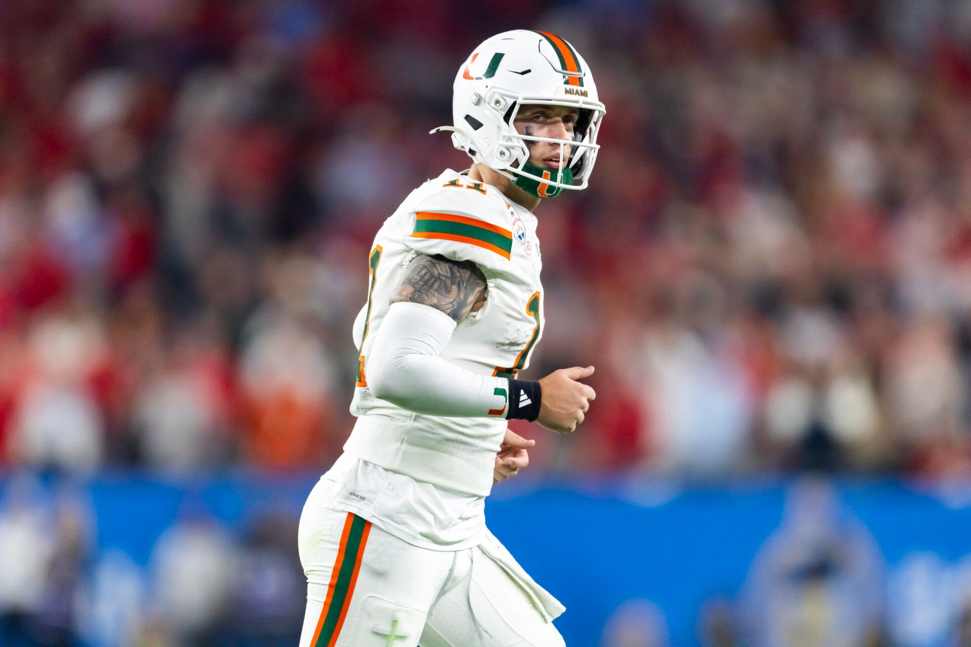 Miami Hurricanes quarterback Carson Beck (11) against the Mississippi Rebels during the 2026 Fiesta Bowl and semifinal game of the College Football Playoff at State Farm Stadium.