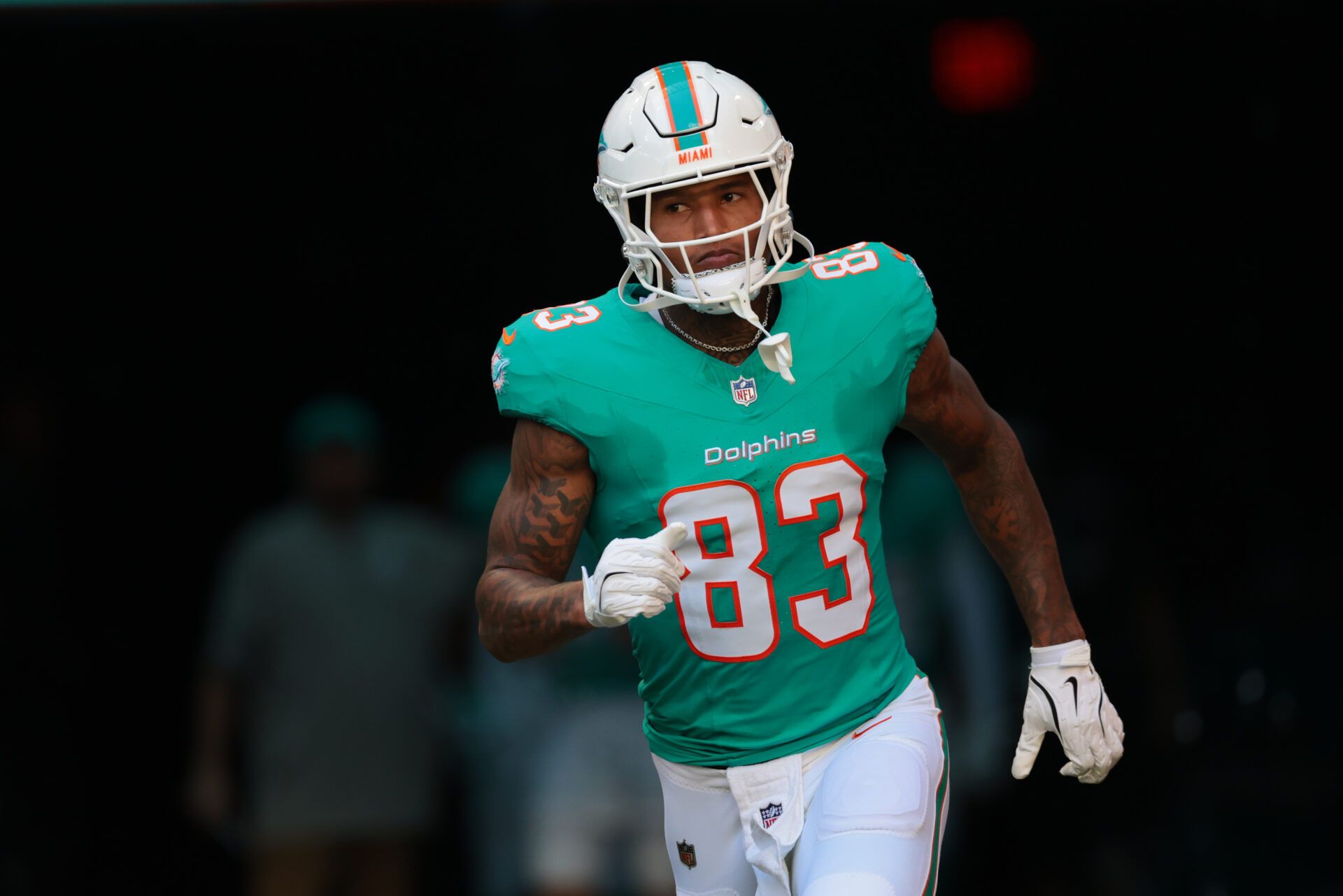 Miami Dolphins tight end Darren Waller (83) runs out for player introductions prior to a game against the Tampa Bay Buccaneers at Hard Rock Stadium.