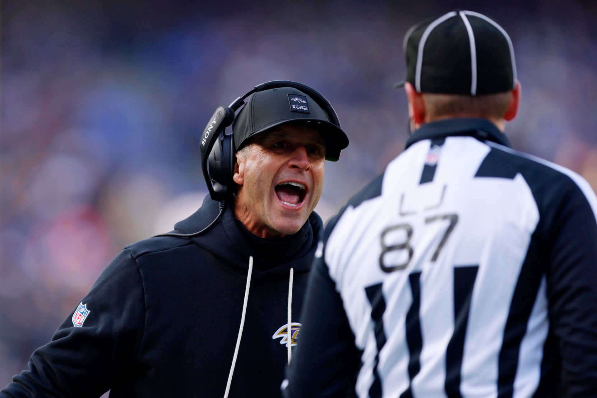Baltimore Ravens head coach John Harbaugh shouts at line judge Tom Eaton (87) after a call following a play against the Pittsburgh Steelers during the first half at M&T Bank Stadium.
