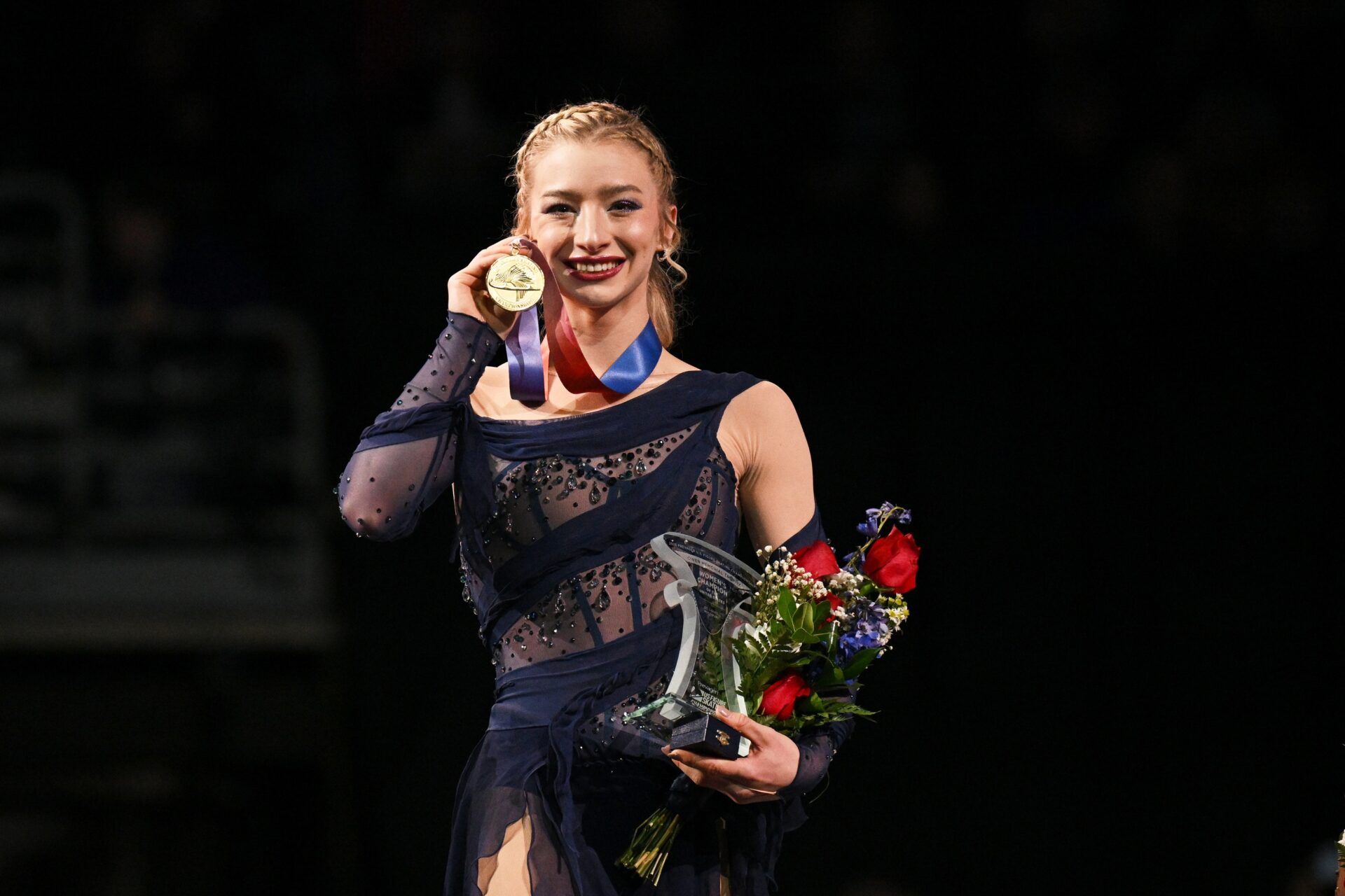 Championship womens free skate gold medalist Amber Glenn poses for a photo on the podium during the 2026 U.S. Figure Skating Championships at Enterprise Center.