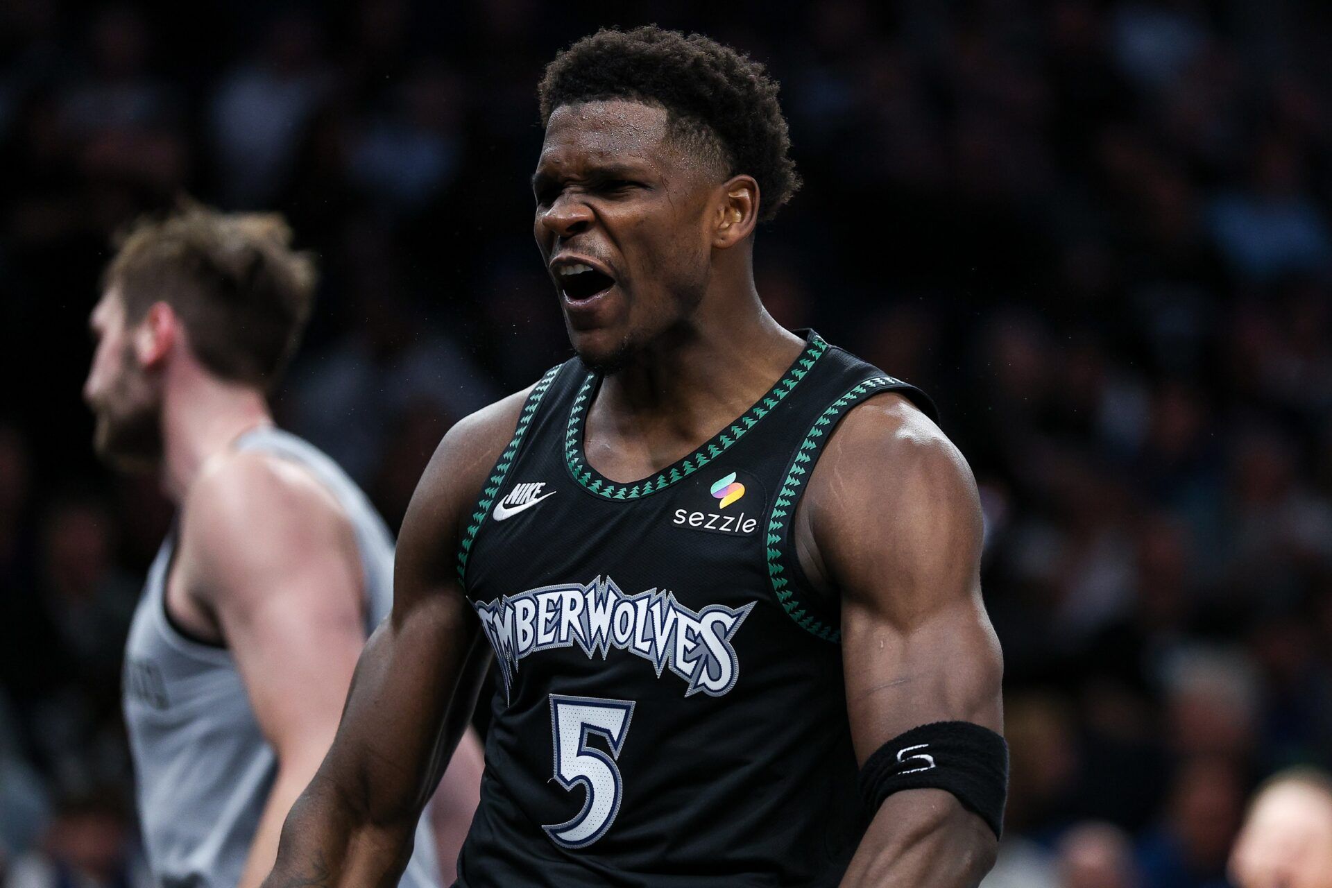 Minnesota Timberwolves guard Anthony Edwards (5) celebrates his basket against the San Antonio Spurs during the second half at Target Center.