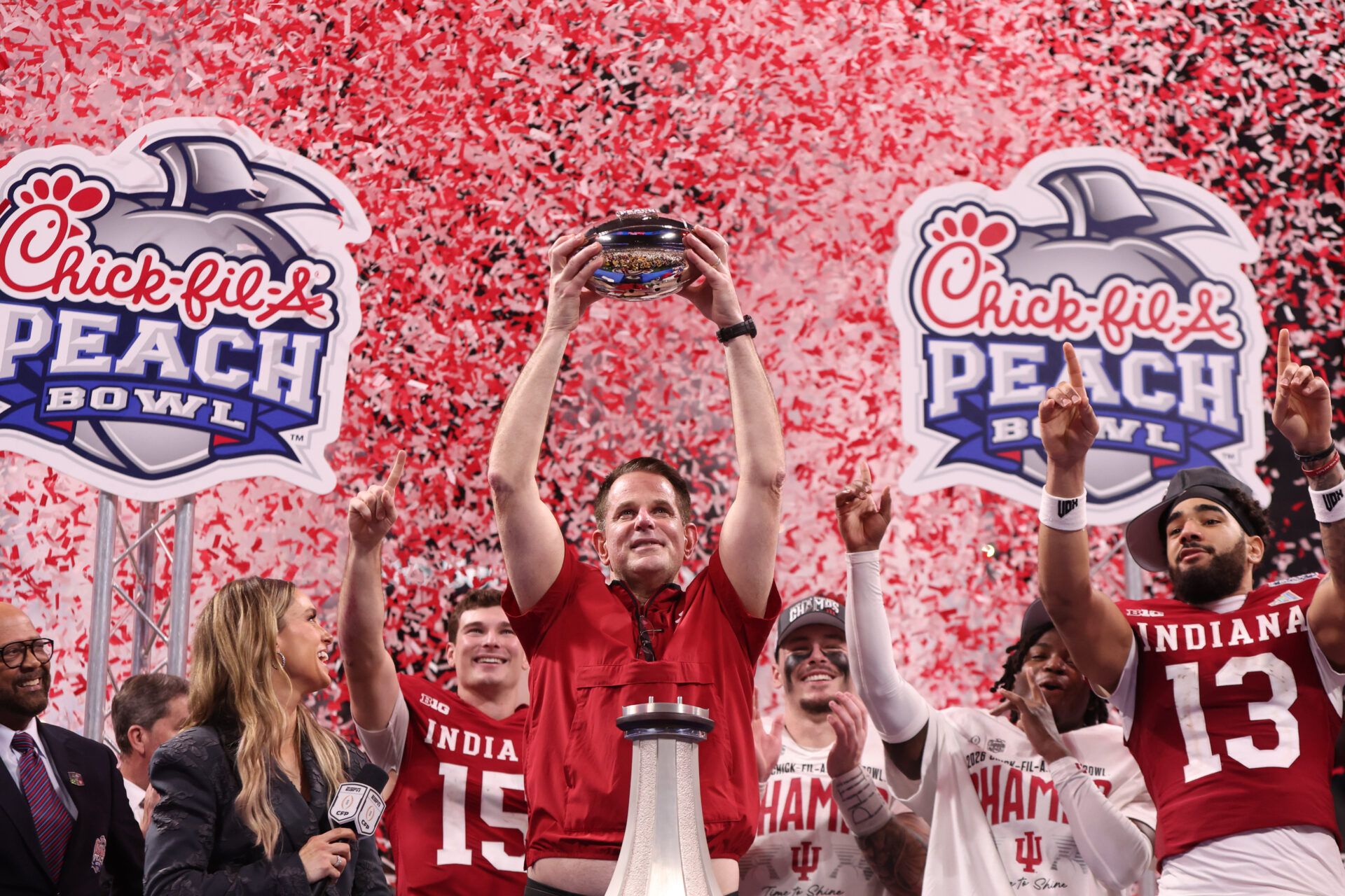 Indiana Hoosiers head coach Curt Cignetti raises the trophy after the 2025 Peach Bowl and semifinal game of the College Football Playoff at Mercedes-Benz Stadium.