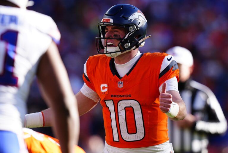 Denver Broncos quarterback Bo Nix (10) calls an audible during the first quarter of an AFC Divisional Round playoff game against the Buffalo Bills at Empower Field at Mile High.