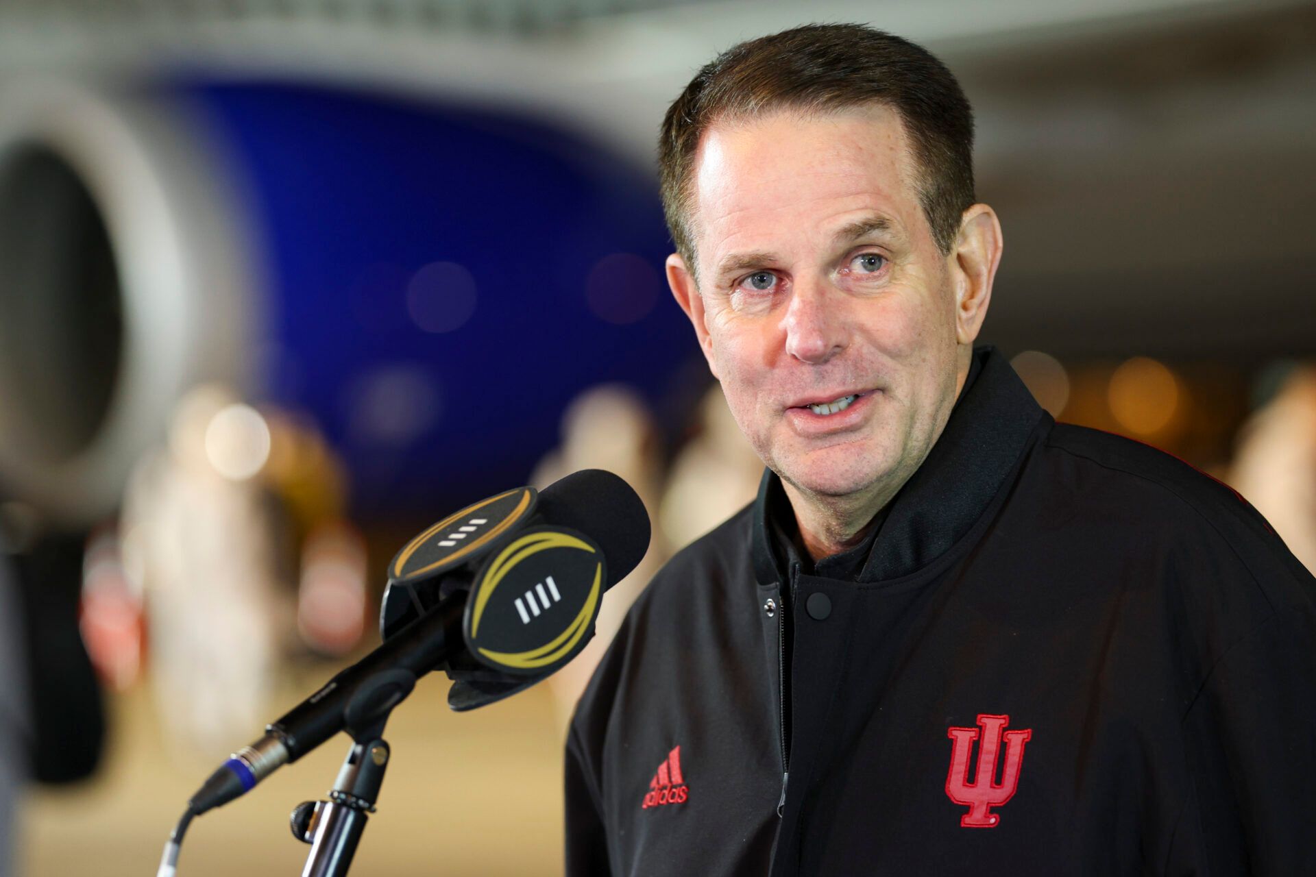 Indiana Hoosiers head coach Curt Cignett talks to media at Miami International Airport before the College Football Playoff National Championship game against the Miami Hurricanes.