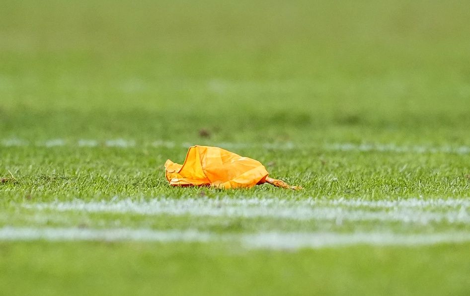 A penalty flag on the field during overtime of an AFC Divisional Round playoff game between the Buffalo Bills and Denver Broncos at Empower Field at Mile High.