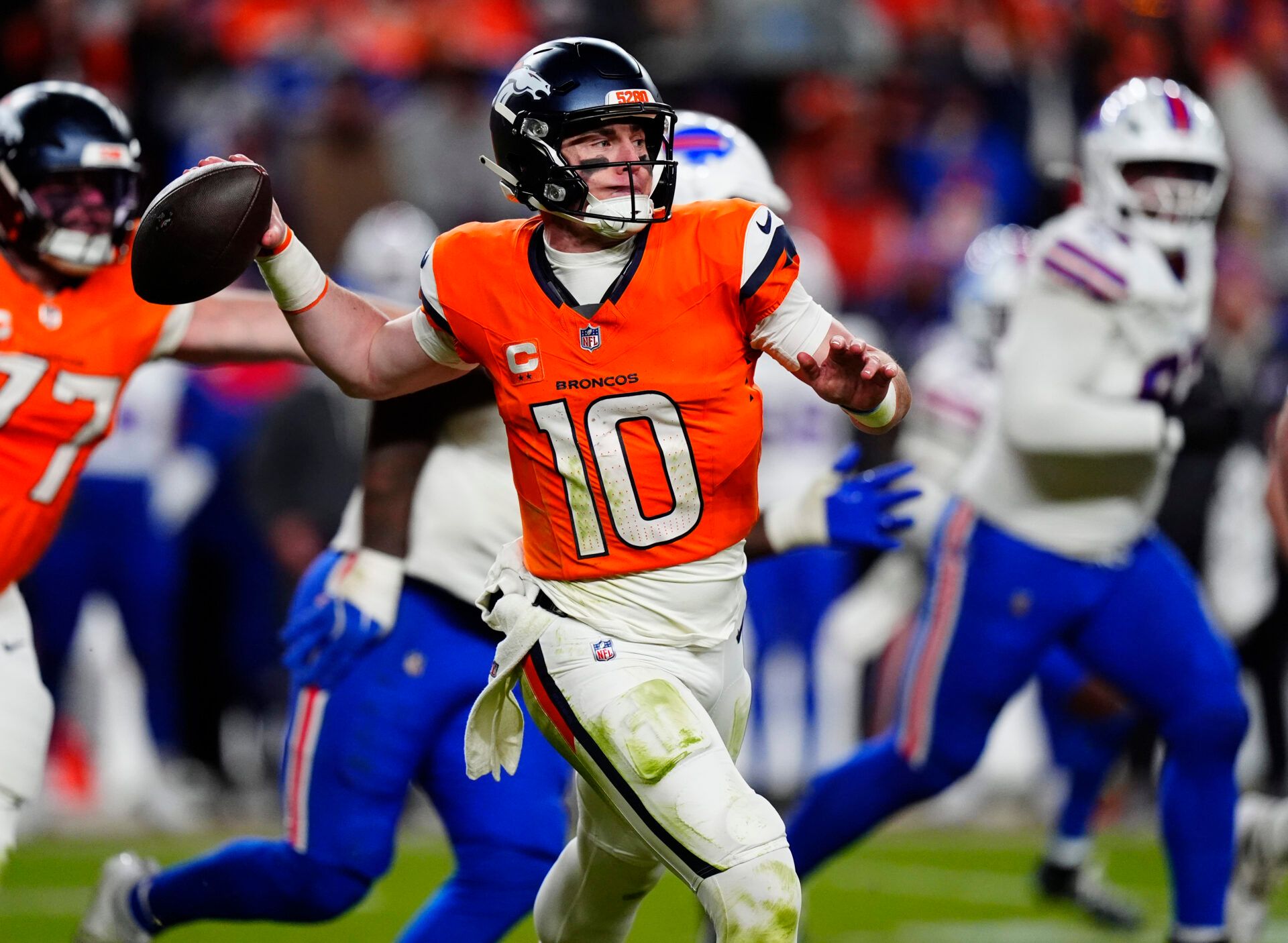 Denver Broncos quarterback Bo Nix (10) throws during the fourth quarter of an AFC Divisional Round playoff game against the Buffalo Bills at Empower Field at Mile High.