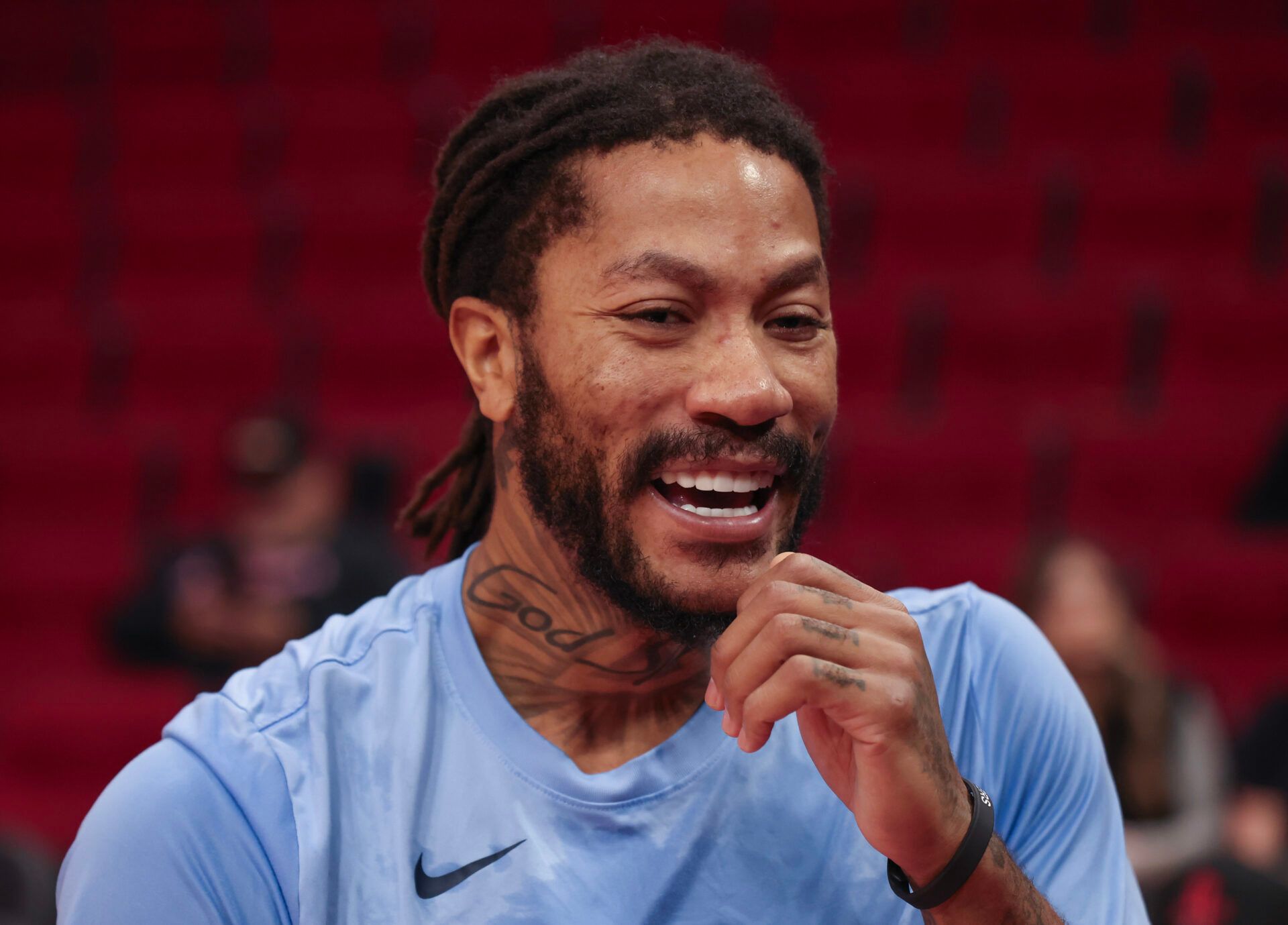 Memphis Grizzlies guard Derrick Rose (23) laughs with a teammate while warming up before playing against the Houston Rockets at Toyota Center.