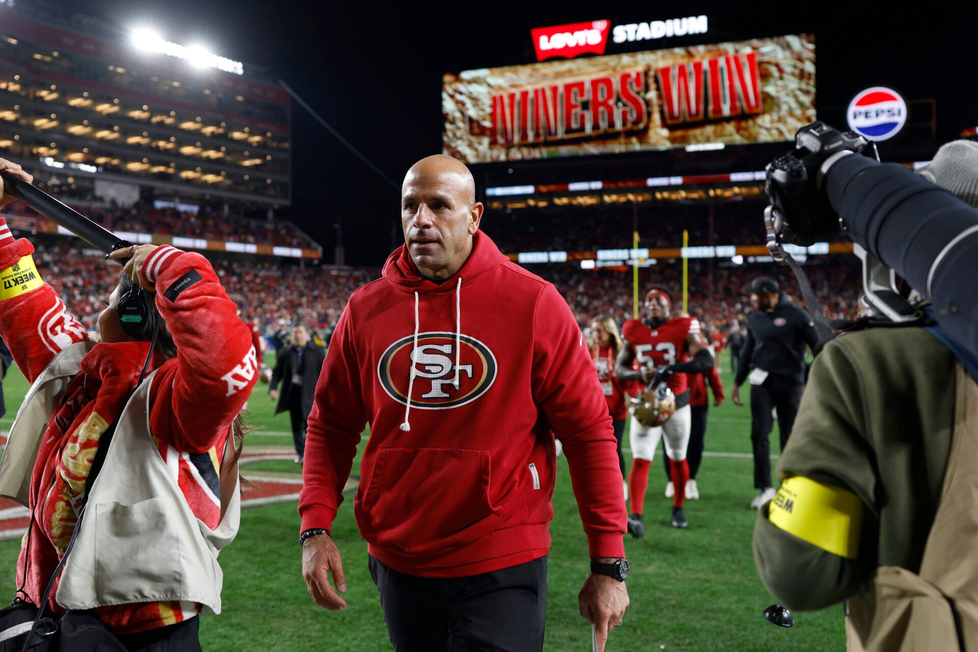 San Francisco 49ers defensive coordinator Robert Saleh leaves the field after defeating the Chicago Bears at Levi's Stadium.