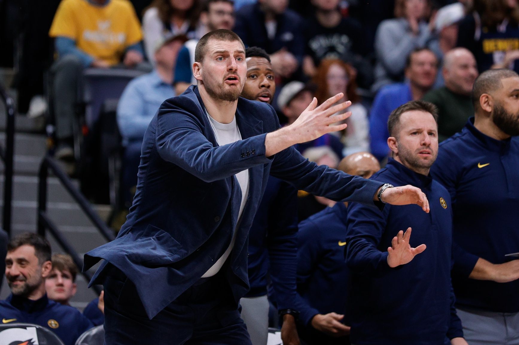 Denver Nuggets center Nikola Jokic reacts from the bench in the fourth quarter against the Milwaukee Bucks at Ball Arena.