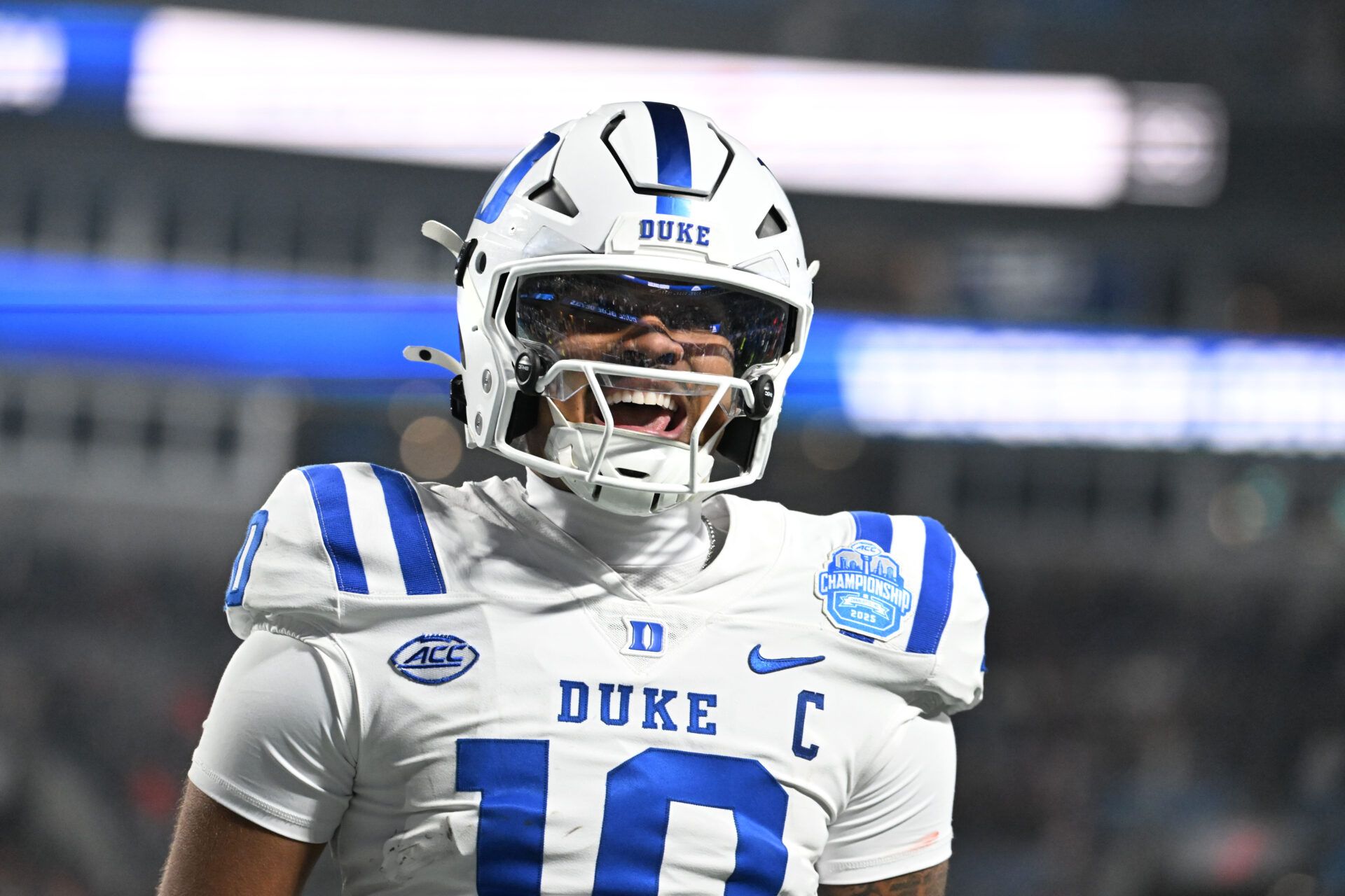 Duke Blue Devils quarterback Darian Mensah (10) celebrates after the Blue Devils score a touchdown in overtime during the  ACC Championship game at Bank of America Stadium.
