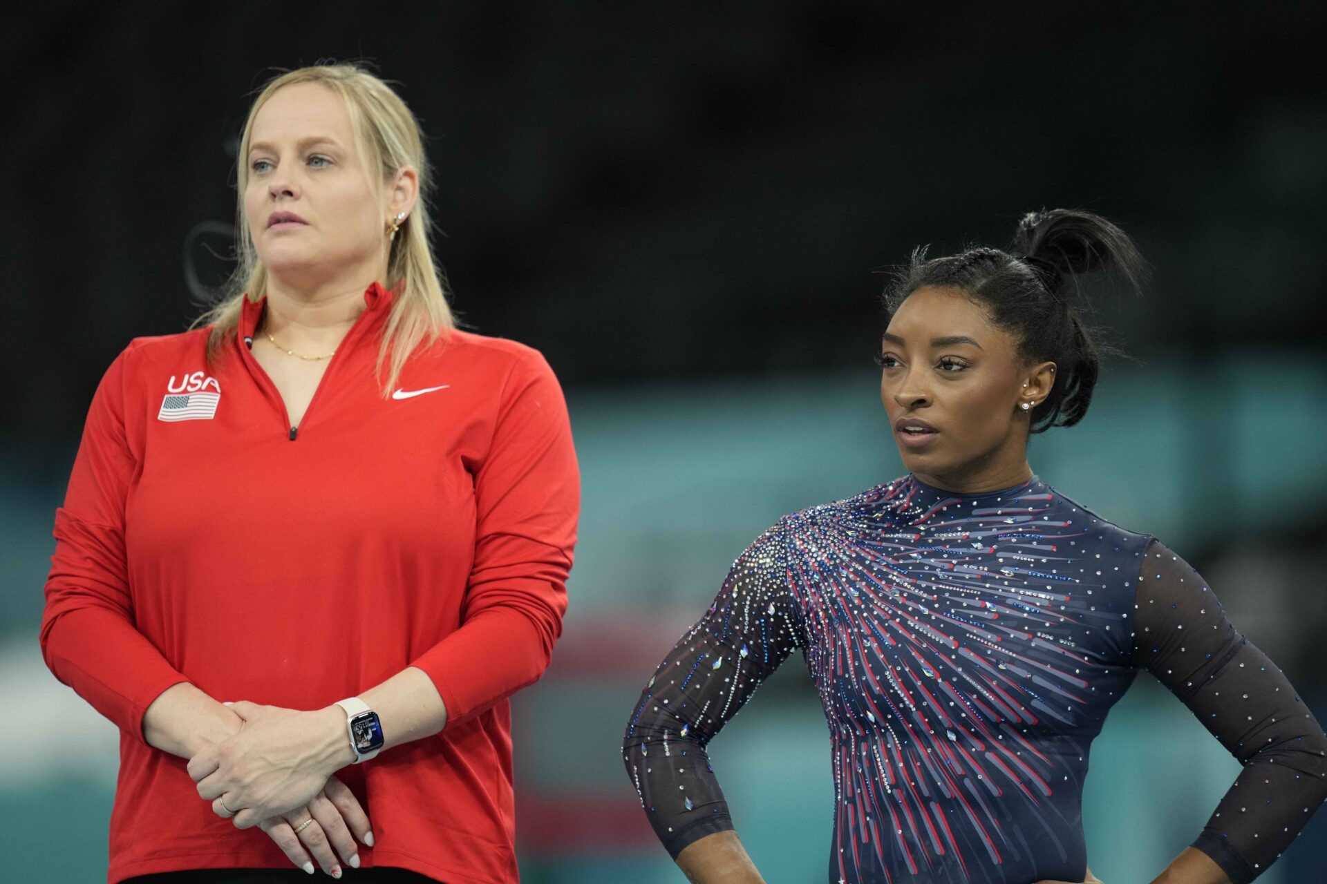 Cecile Canqueteau-Landi and Simone Biles during a practice session before the Paris 2024 Olympic Summer Games at Bercy Arena.