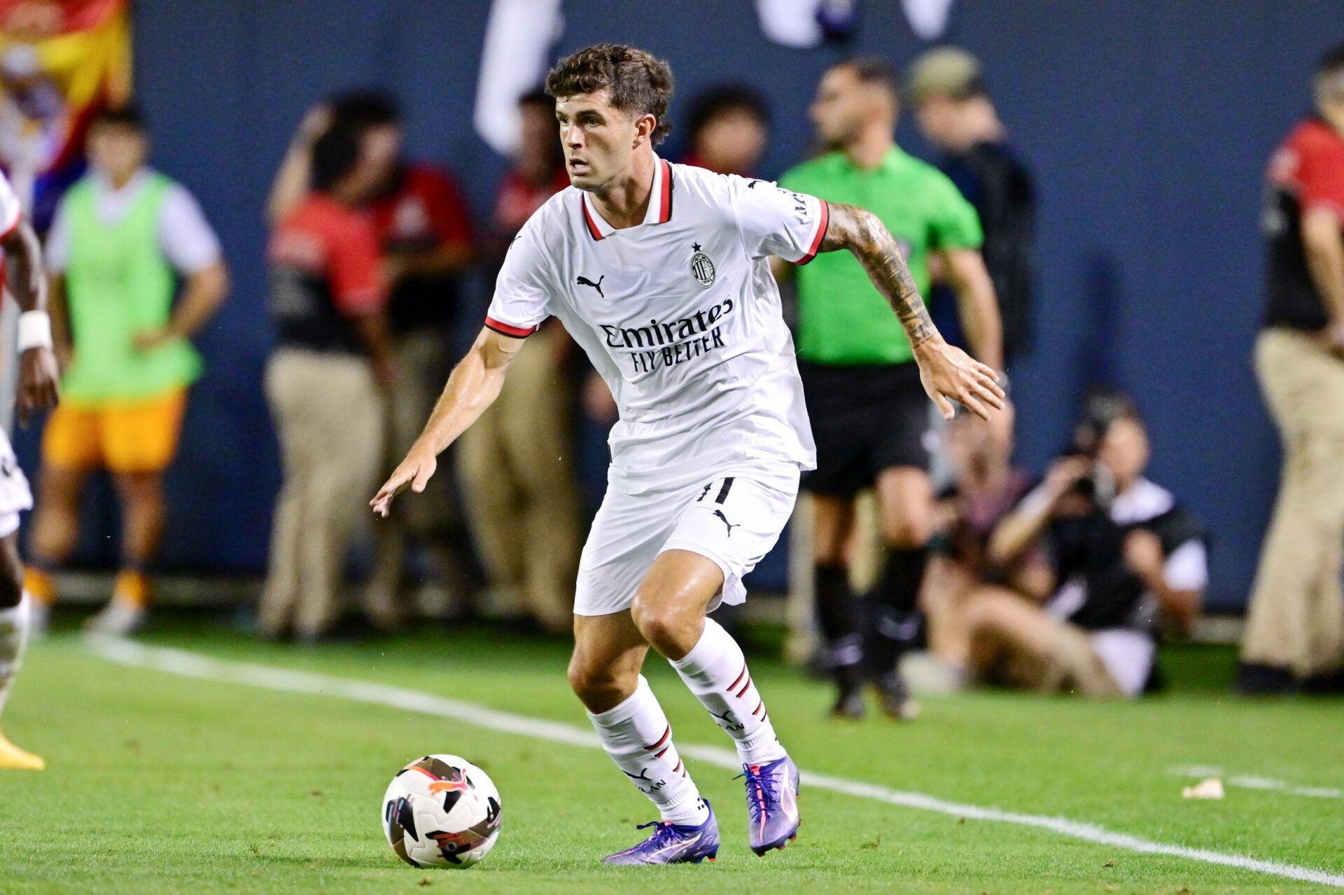 AC Milan midfielder Christian Pulisic (11) dribbles the ball against Real Madrid during the second half at Soldier Field.