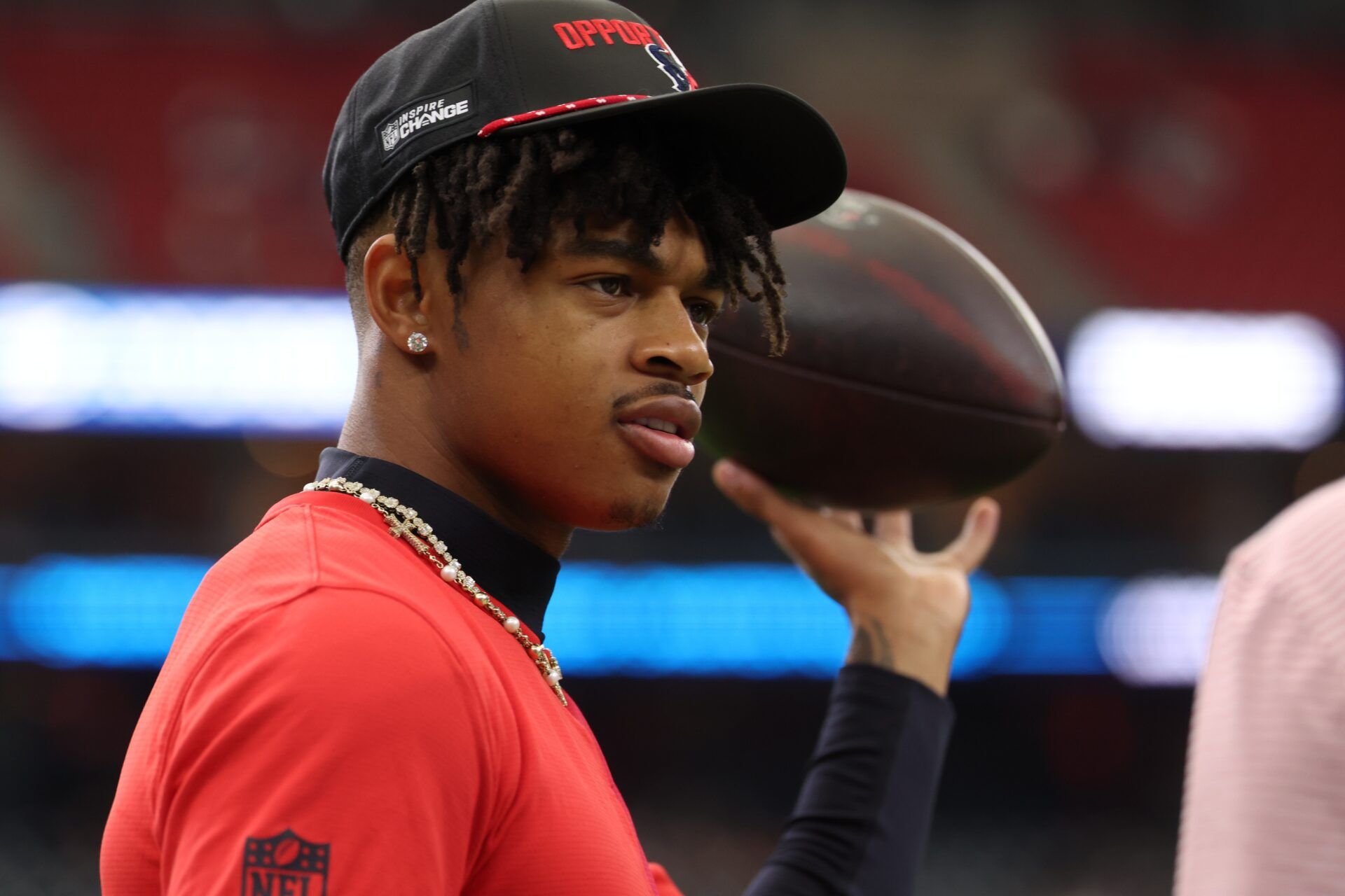 Houston Texans wide receiver Tank Dell (3) walks on the field talking to teammates  before the Texans play against the Arizona Cardinals at NRG Stadium.