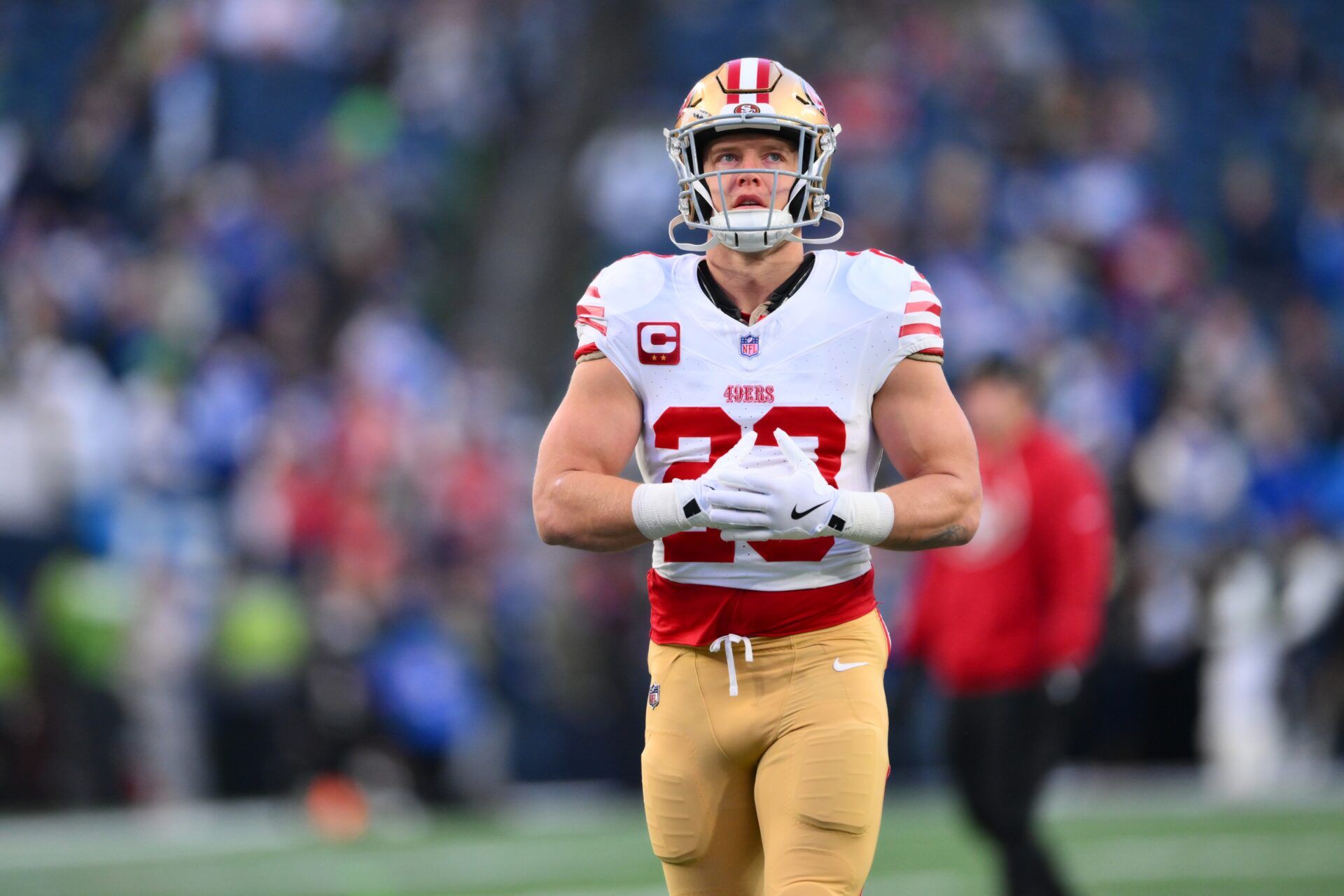 San Francisco 49ers running back Christian McCaffrey (23) warms up prior to a game against the Seattle Seahawks in an NFC Divisional Round game at Lumen Field.