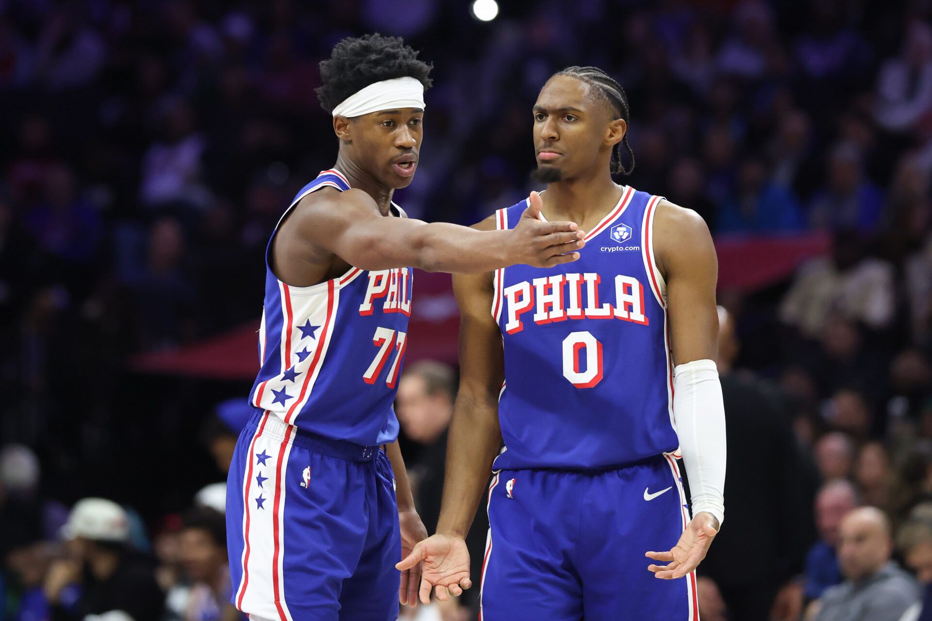 Philadelphia 76ers guard Vj Edgecombe (77) and guard Tyrese Maxey (0) talk during the third quarter against the Denver Nuggets at Xfinity Mobile Arena.