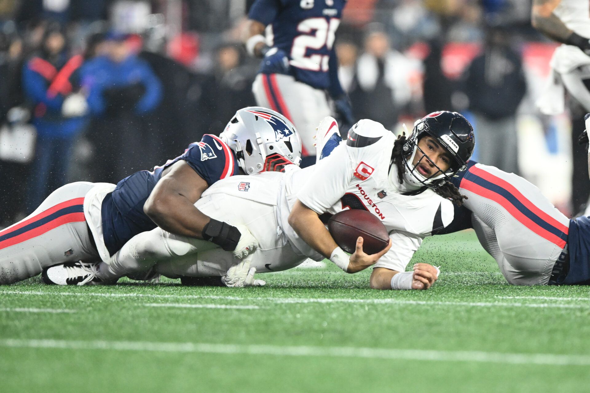 Houston Texans quarterback C.J. Stroud (7) is sacked in the second quarter against the New England Patriots in an AFC Divisional Round game at Gillette Stadium.