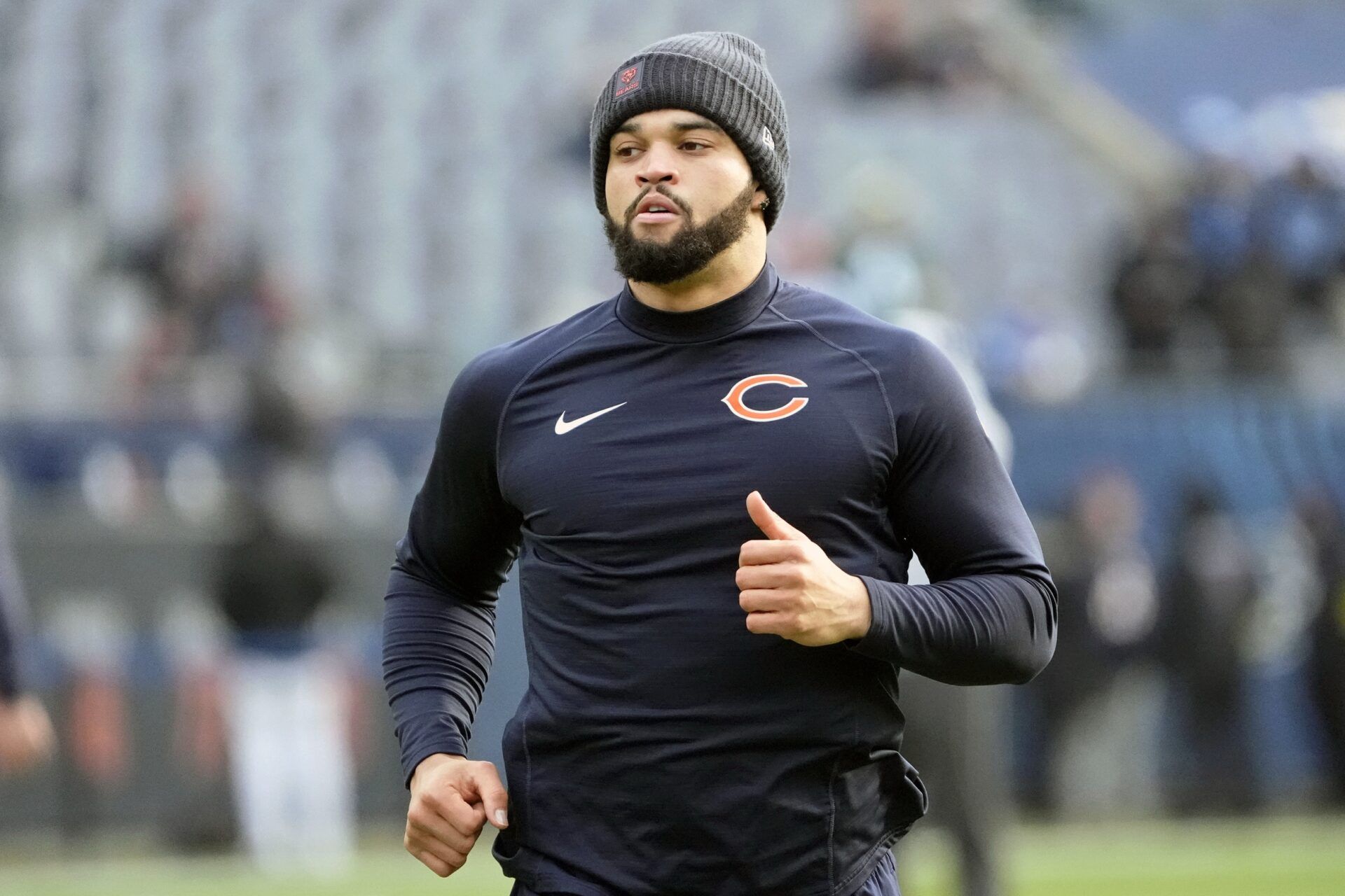 Chicago Bears quarterback Caleb Williams (18) warms up before the game between the Chicago Bears and the Detroit Lions at Soldier Field.