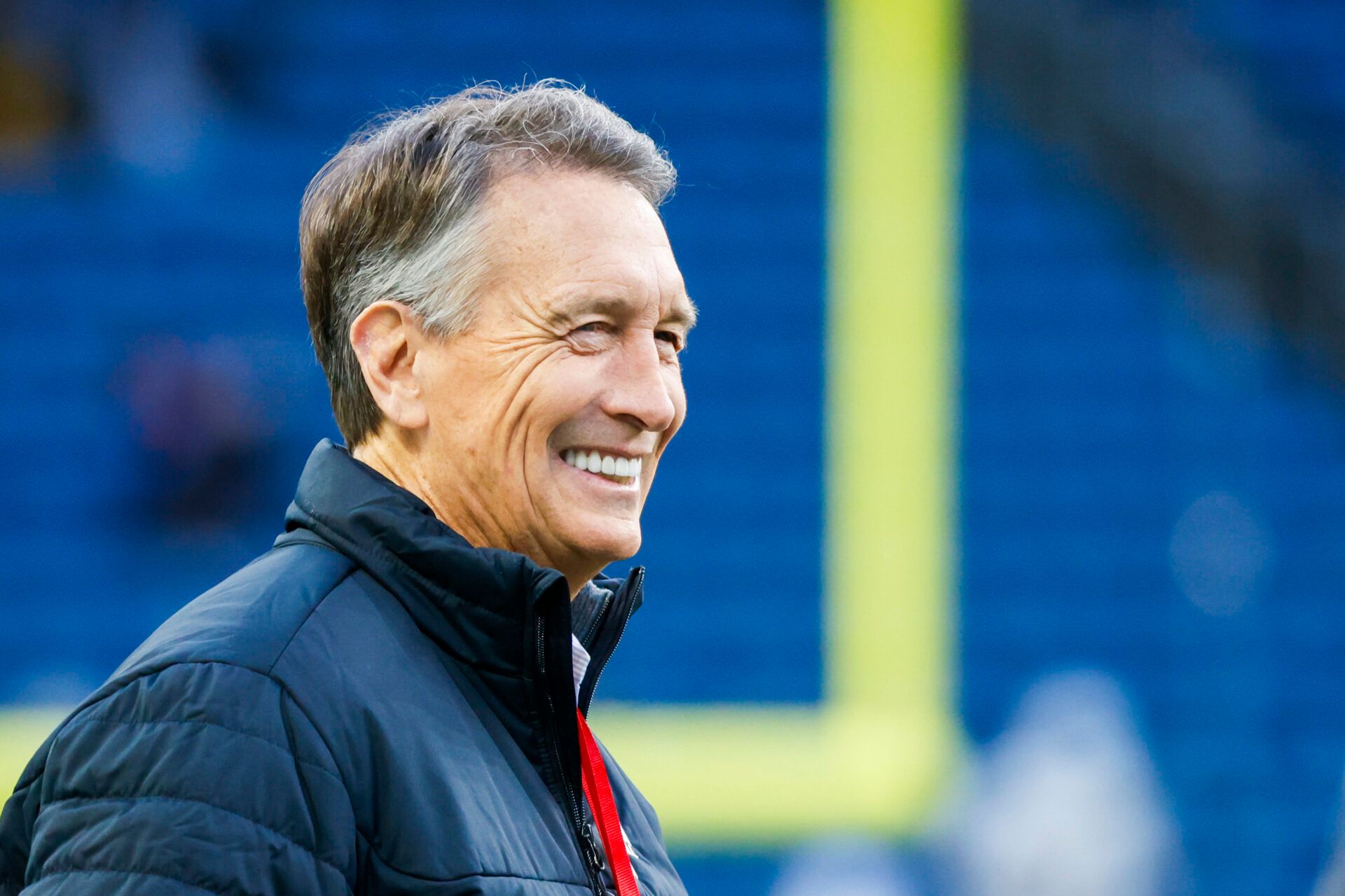 NBC football commentator Chris Collinsworth watches pregame warmups between the Green Bay Packers and Seattle Seahawks at Lumen Field.