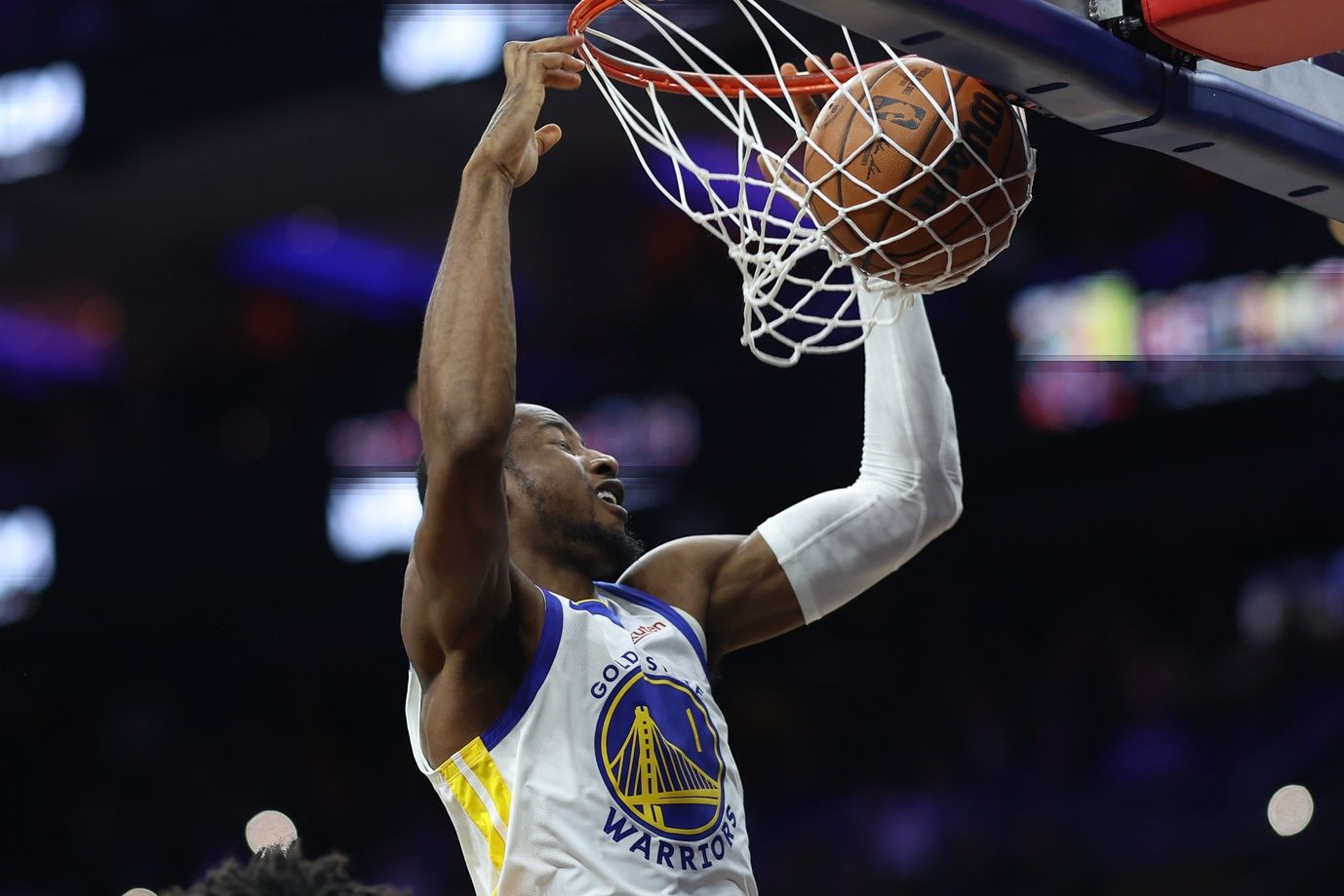 Golden State Warriors forward Jonathan Kuminga (1) dunks the ball against the Philadelphia 76ers during the third quarter at Xfinity Mobile Arena.