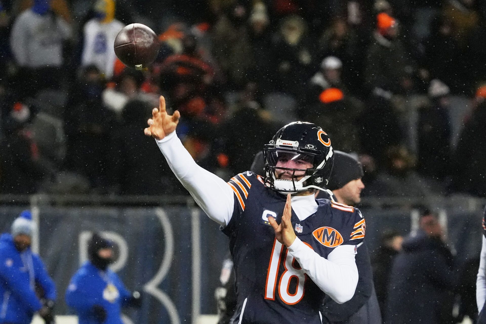Chicago Bears quarterback Caleb Williams (18) throws a pass during warmups before an NFC Divisional Round game against the Los Angeles Rams at Soldier Field.