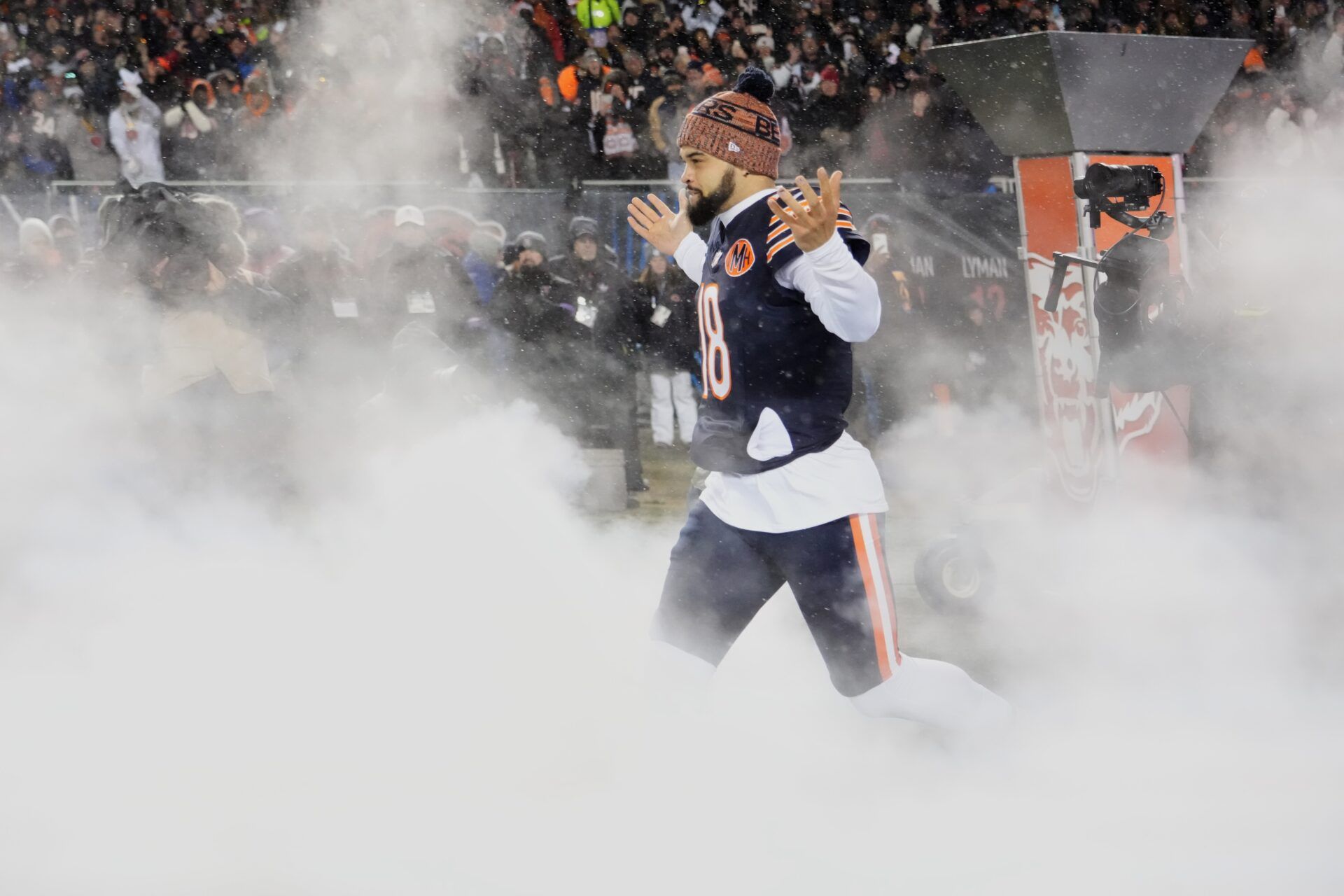 Chicago Bears quarterback Caleb Williams (18) runs onto the field during player introductions before an NFC Divisional Round game against the Los Angeles Rams at Soldier Field.