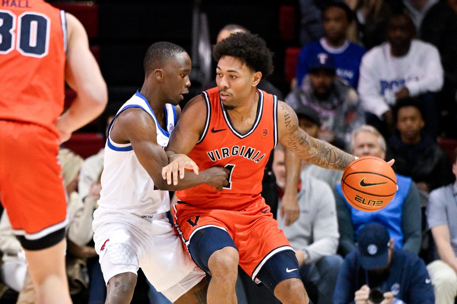 Virginia Cavaliers guard Malik Thomas (1) looks to move the ball past SMU Mustangs guard Boopie Miller (2) during the second half at Moody Coliseum.